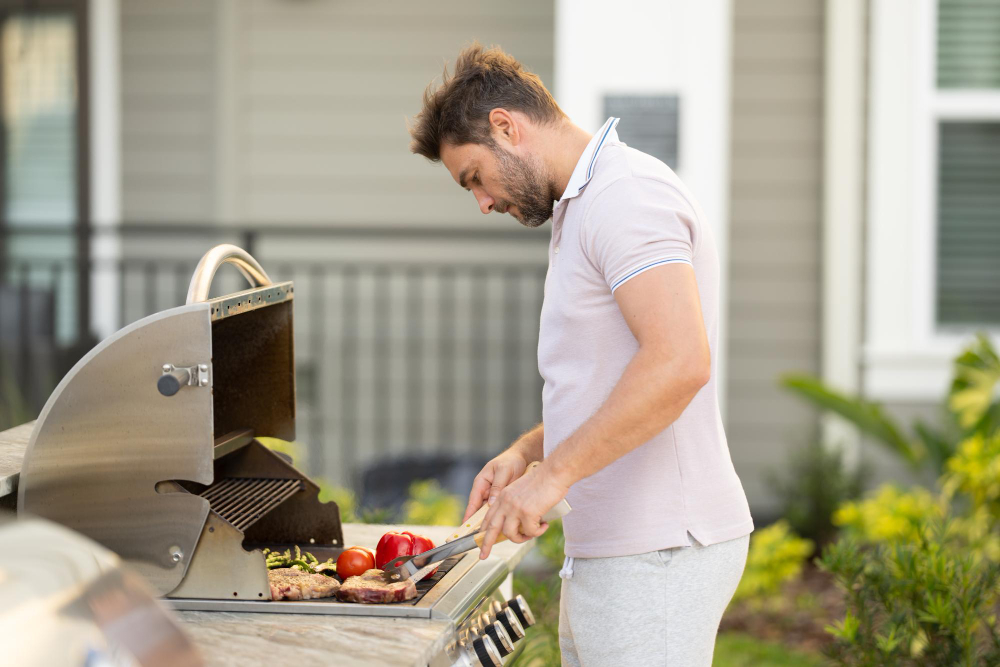 Incorporate an Outdoor Kitchen with a Grill or Pizza Oven