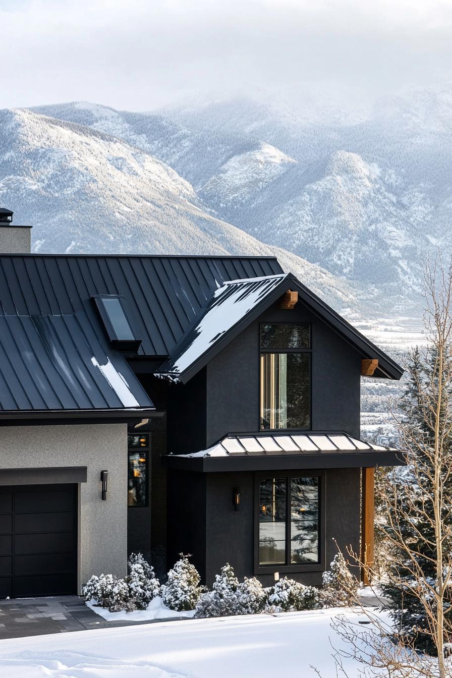 modern house charcoal stucco facade with black metal roof winter mountains in the background 2