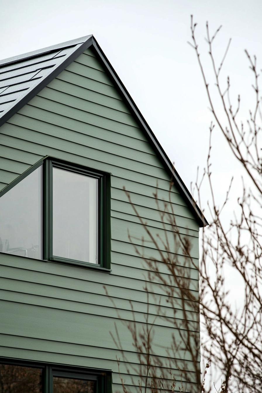 modern geometric Scandinavian house with sage green cladding 3