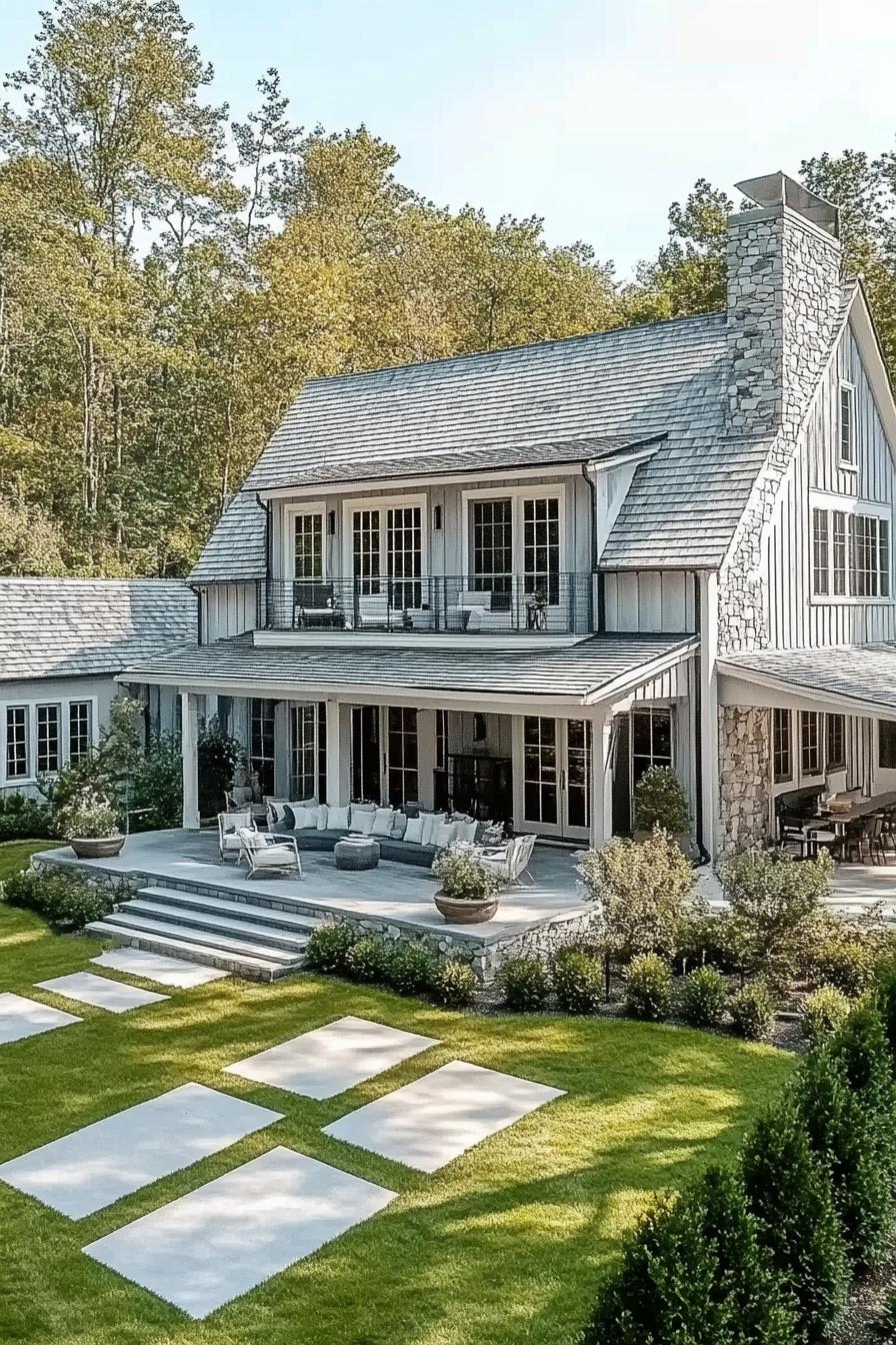 high angle view of a large barn style house with pale grey clapboard facade light grey multi pitch barn gambrel roof with chimney second floor 2