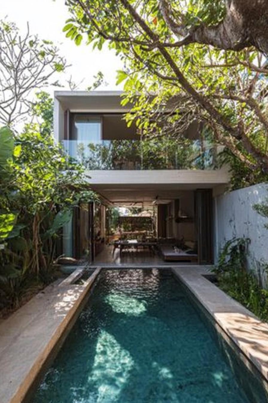 modern house with a compact pool along the wall tree lined garden 3