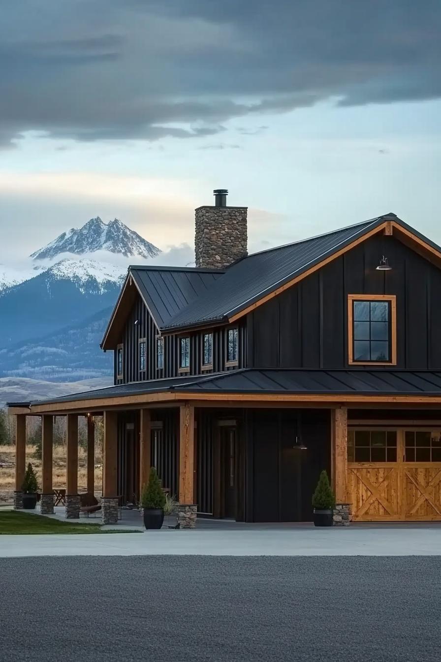 black shouse barndominium with cedar doors and exposed beams large porch chimney majestic mountains in the background 1