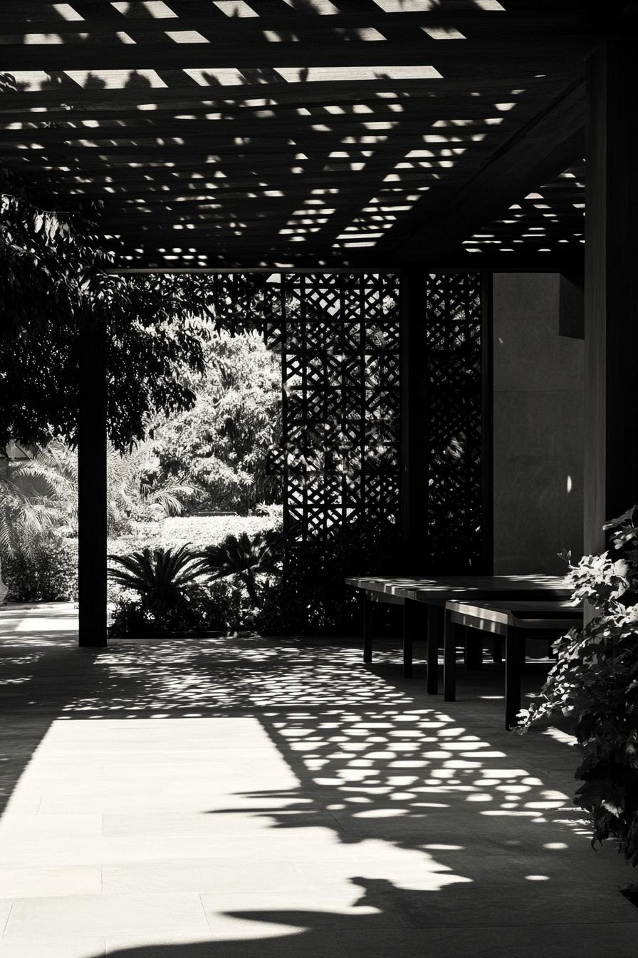 inner courtyard of a modern house with a large pattern pavillion filtering light shadows dropping on garden plants