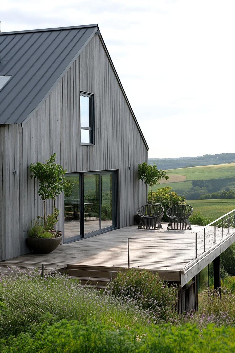 modern barn house with gray timber cladding wooden deck patio chairs