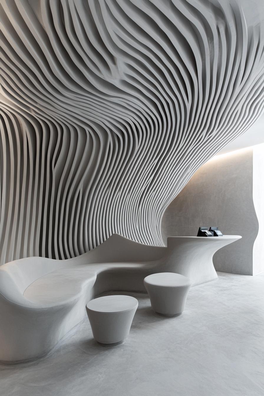 Sculptural white lobby with futuristic furniture