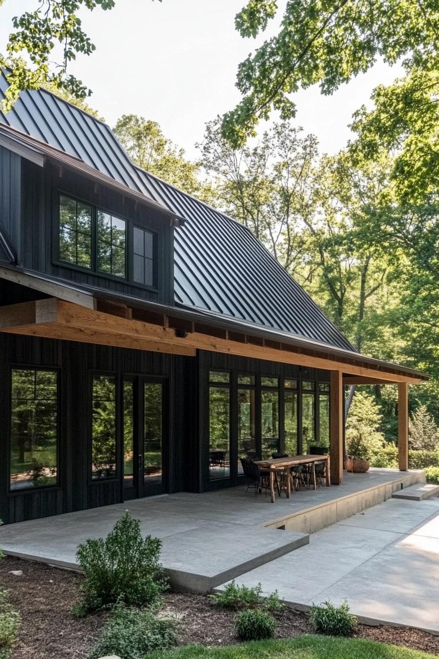 Modern black barndominium with large windows and a sleek roof