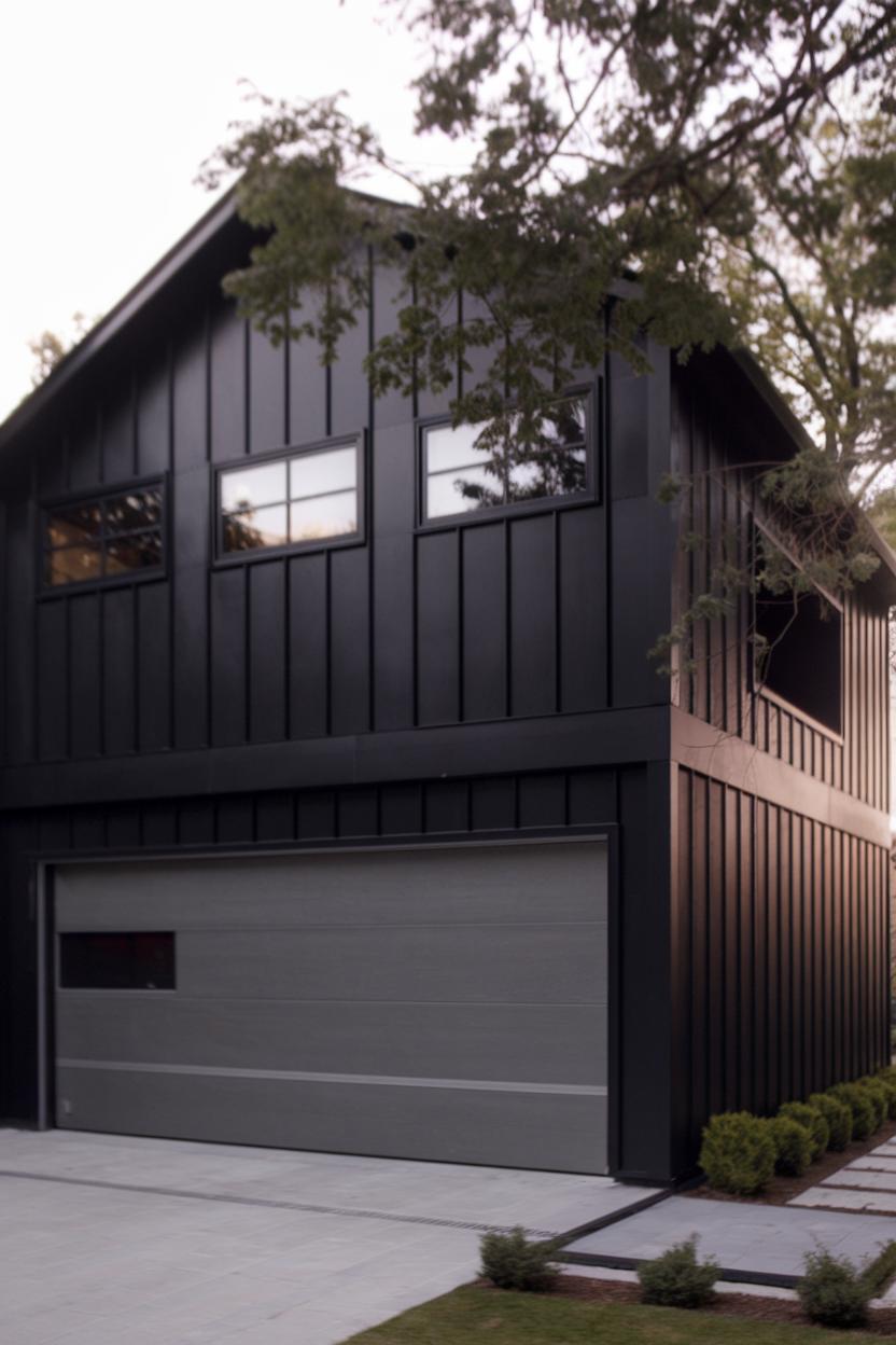 Sleek black garage house with a loft