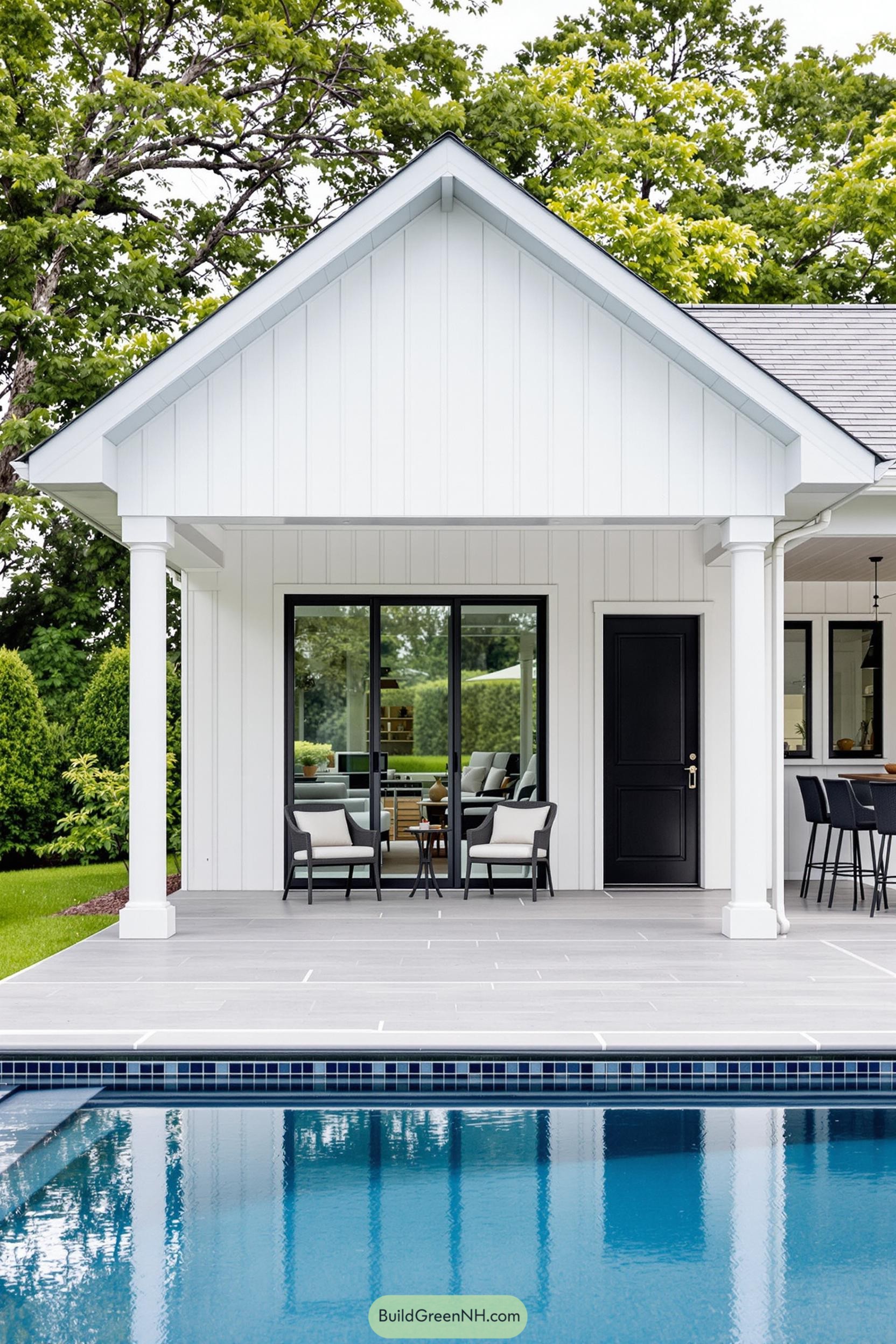 Modern poolside house with patio and chairs