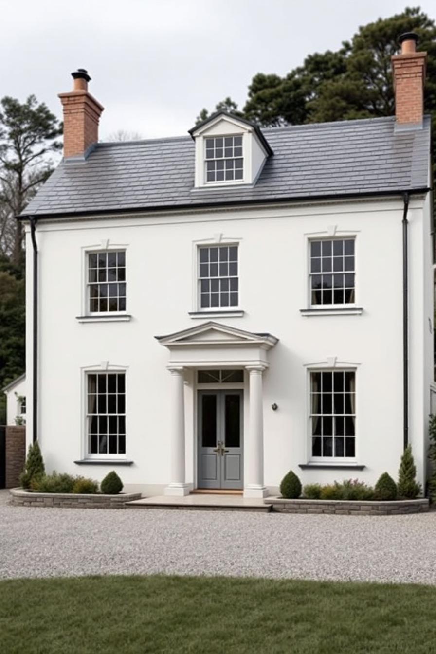 Elegant white Georgian cottage with gray roof and chimney