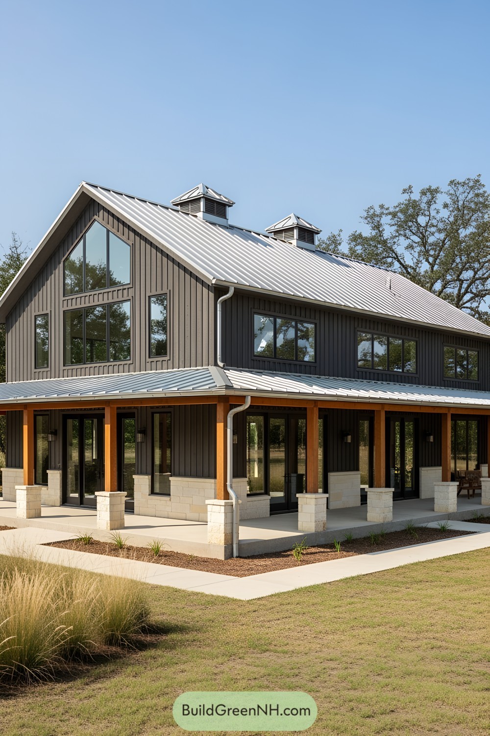 Farmhouse barndominium with large windows and metal roof