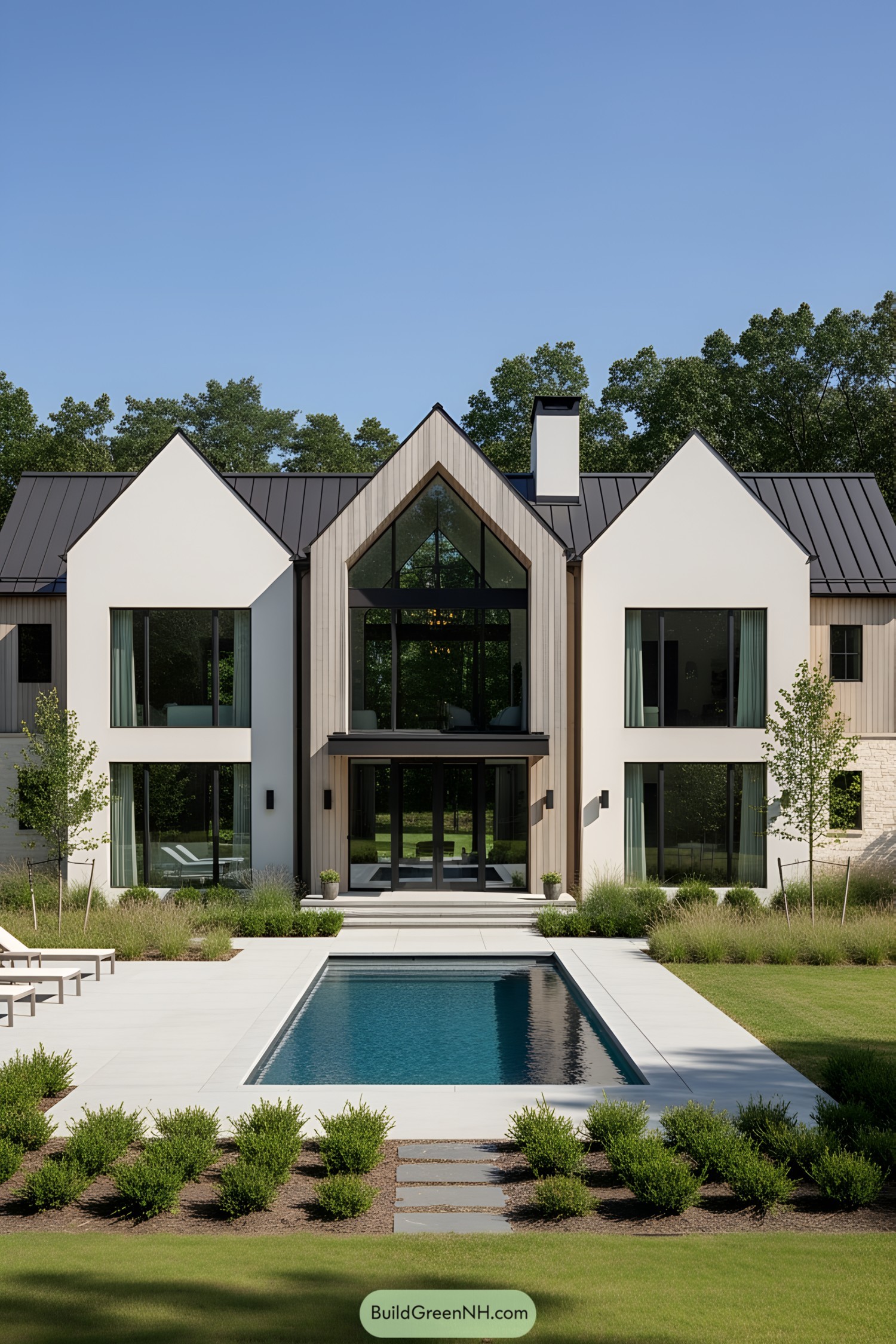 Contemporary farmhouse with large glass windows and a pool