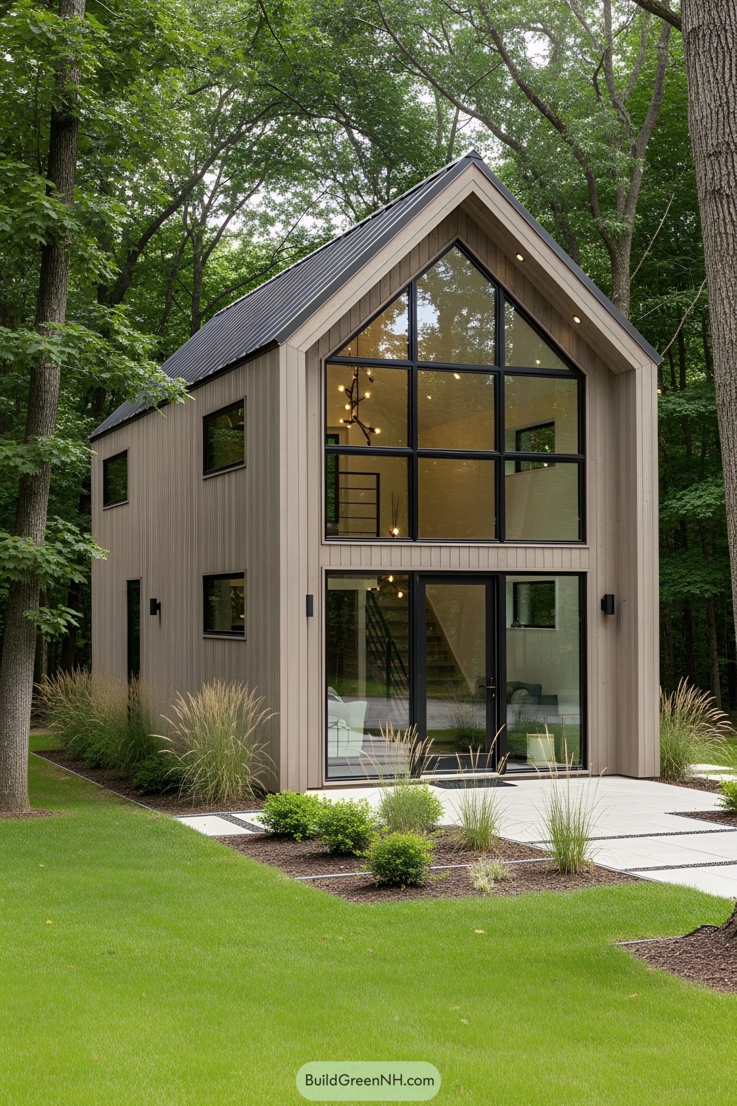 Compact house with tall windows in a wooded setting