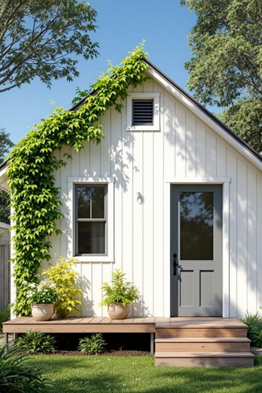 Small white cottage with board and batten siding and leafy vines climbing the roof