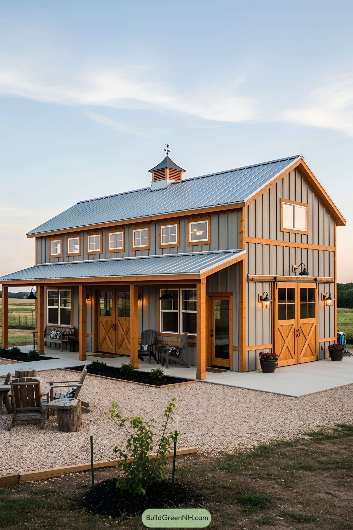 Small barndominium with a metal roof and wooden porch