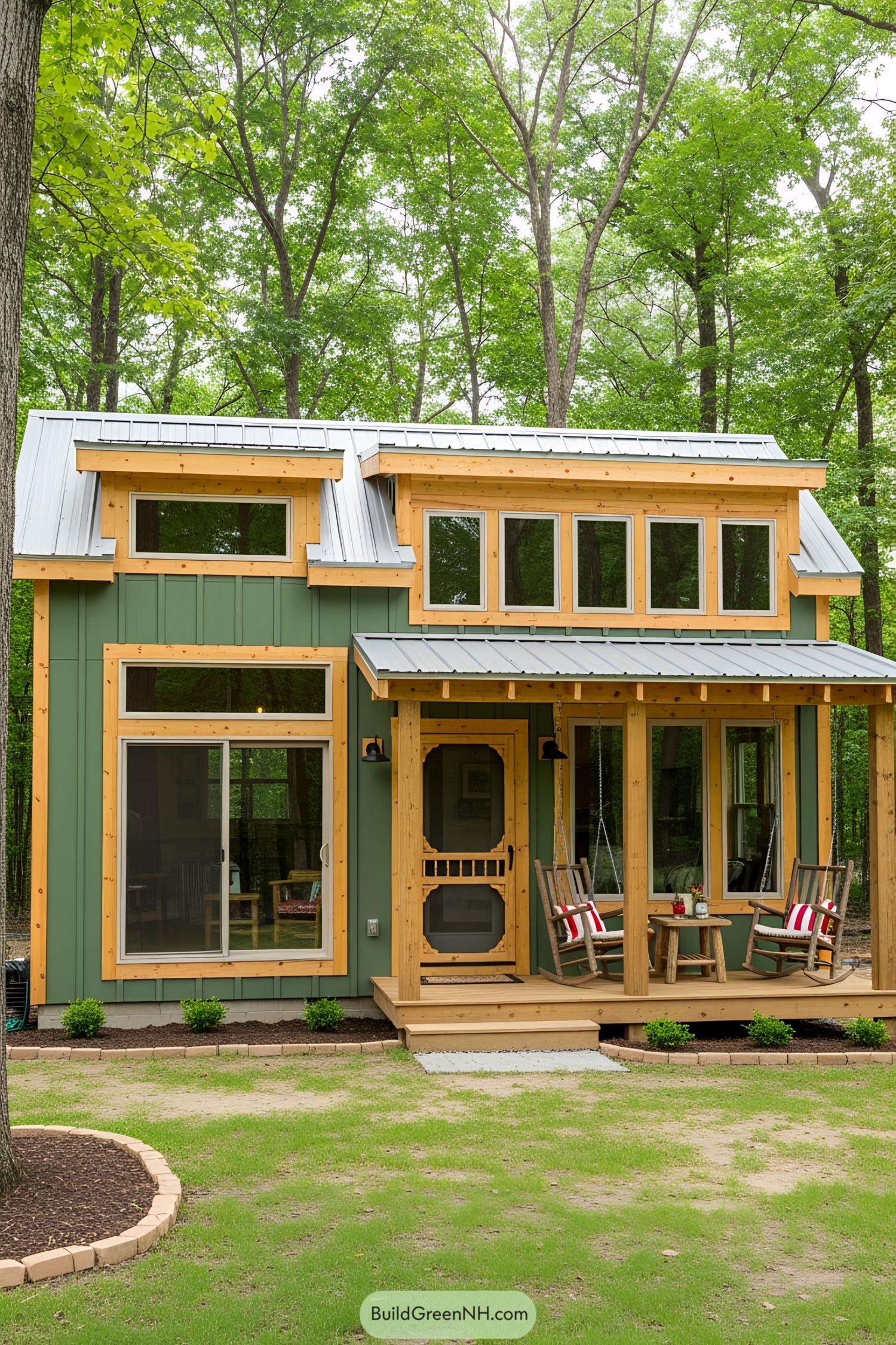 Charming small green house in a forest with a cozy porch