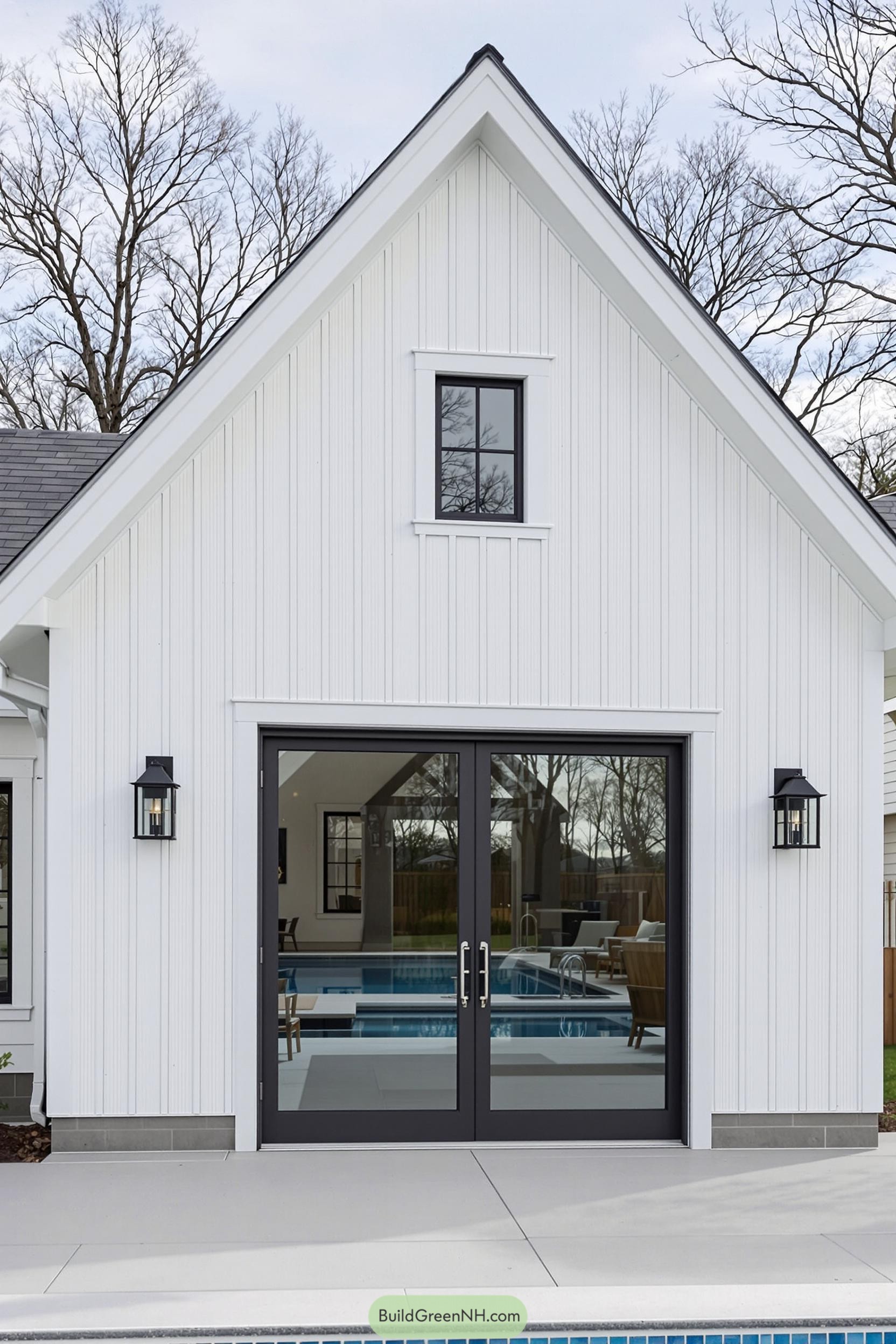Modern pool house with large glass doors