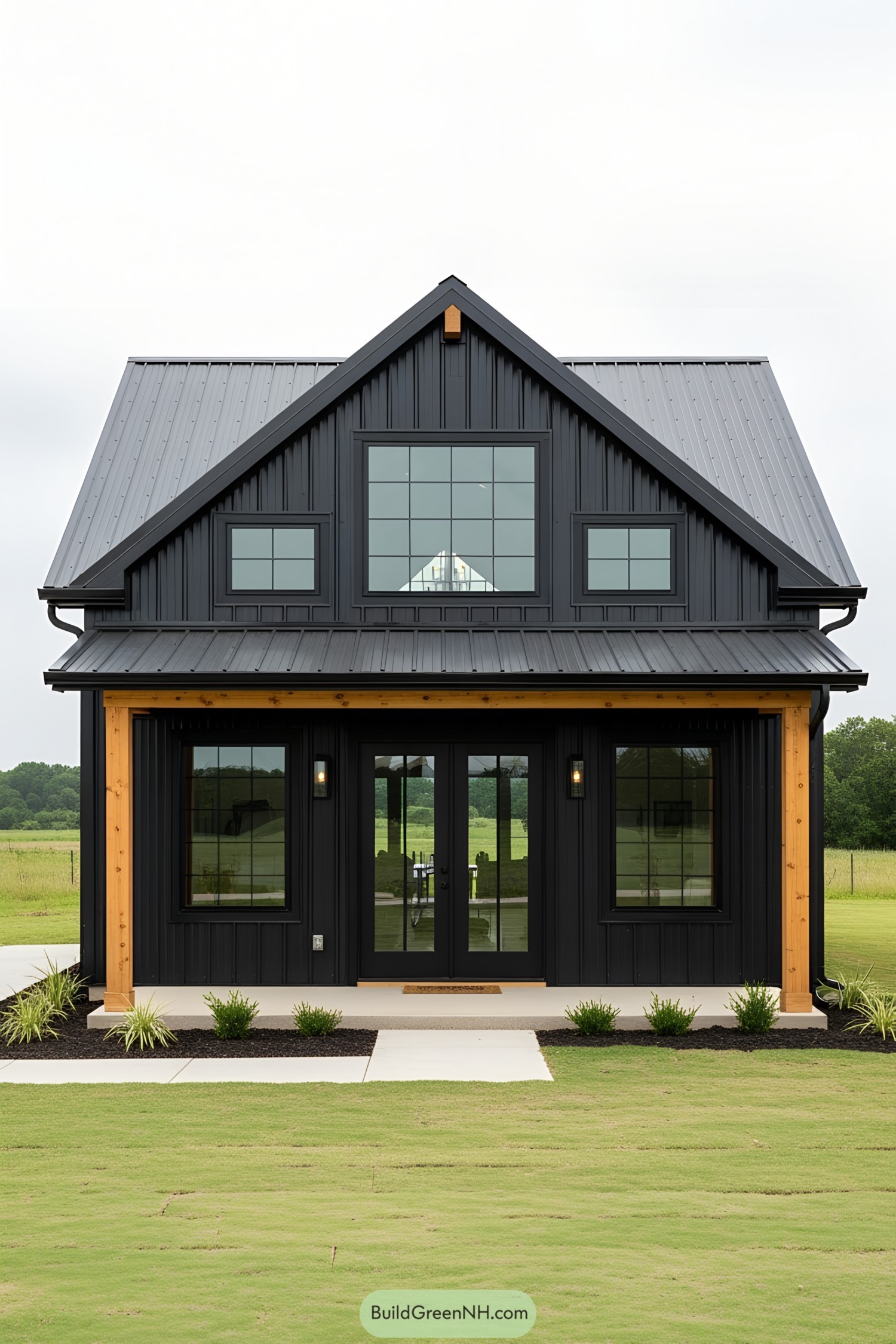 Compact black barndominium with a sleek design