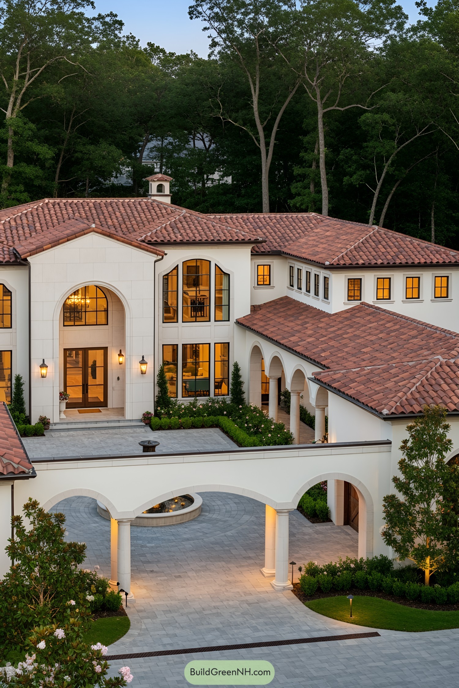 Luxury Mediterranean home with terracotta roof and grand archways