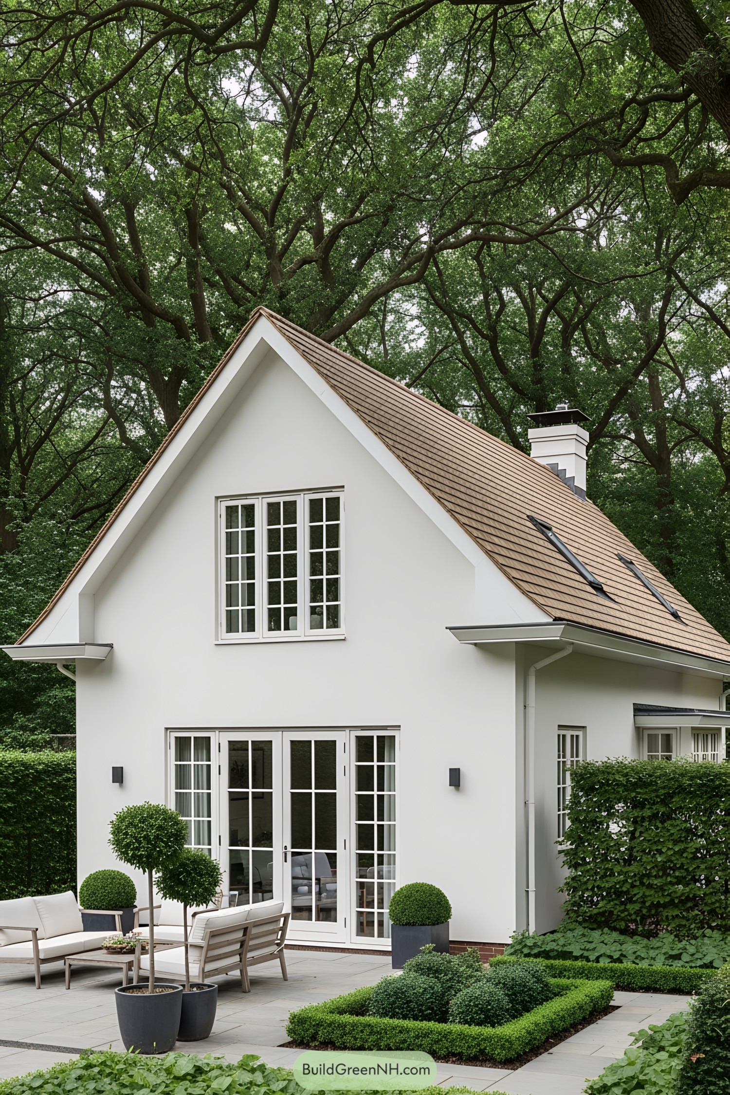 Compact white bungalow with lush greenery
