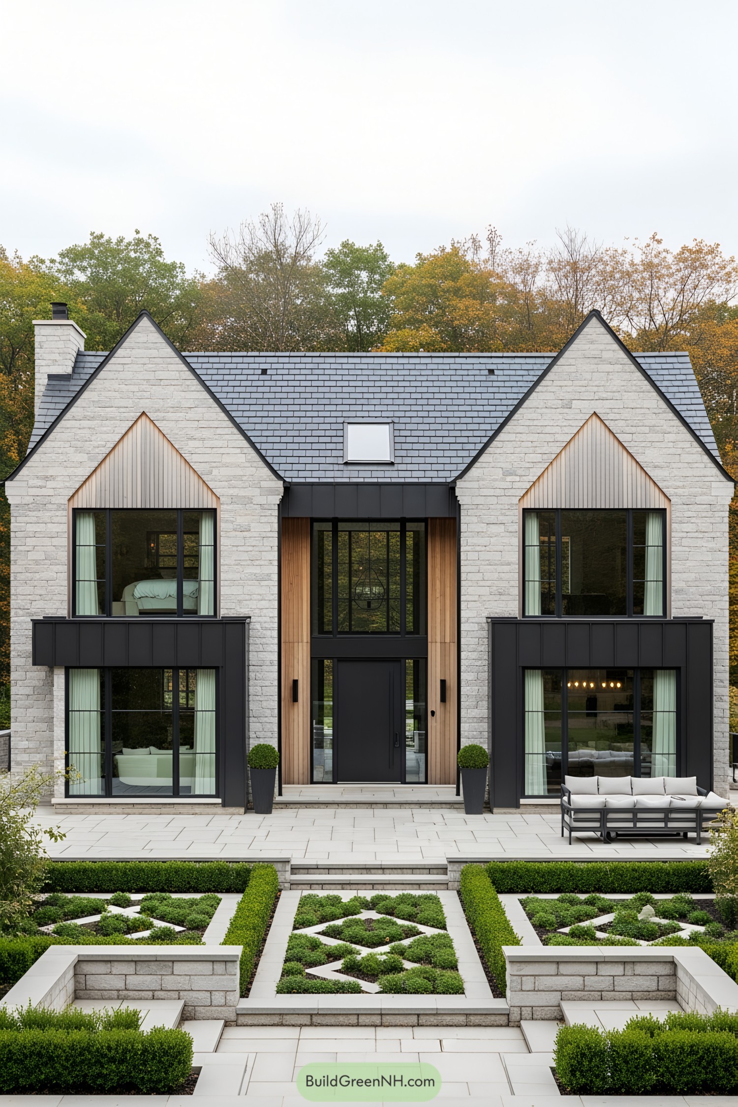 Elegant brick farmhouse with large windows and manicured garden