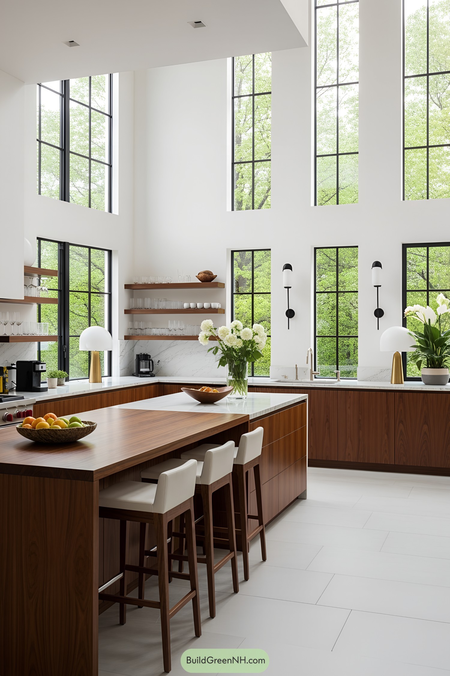 Modern kitchen with large windows, wooden accents, and white countertops