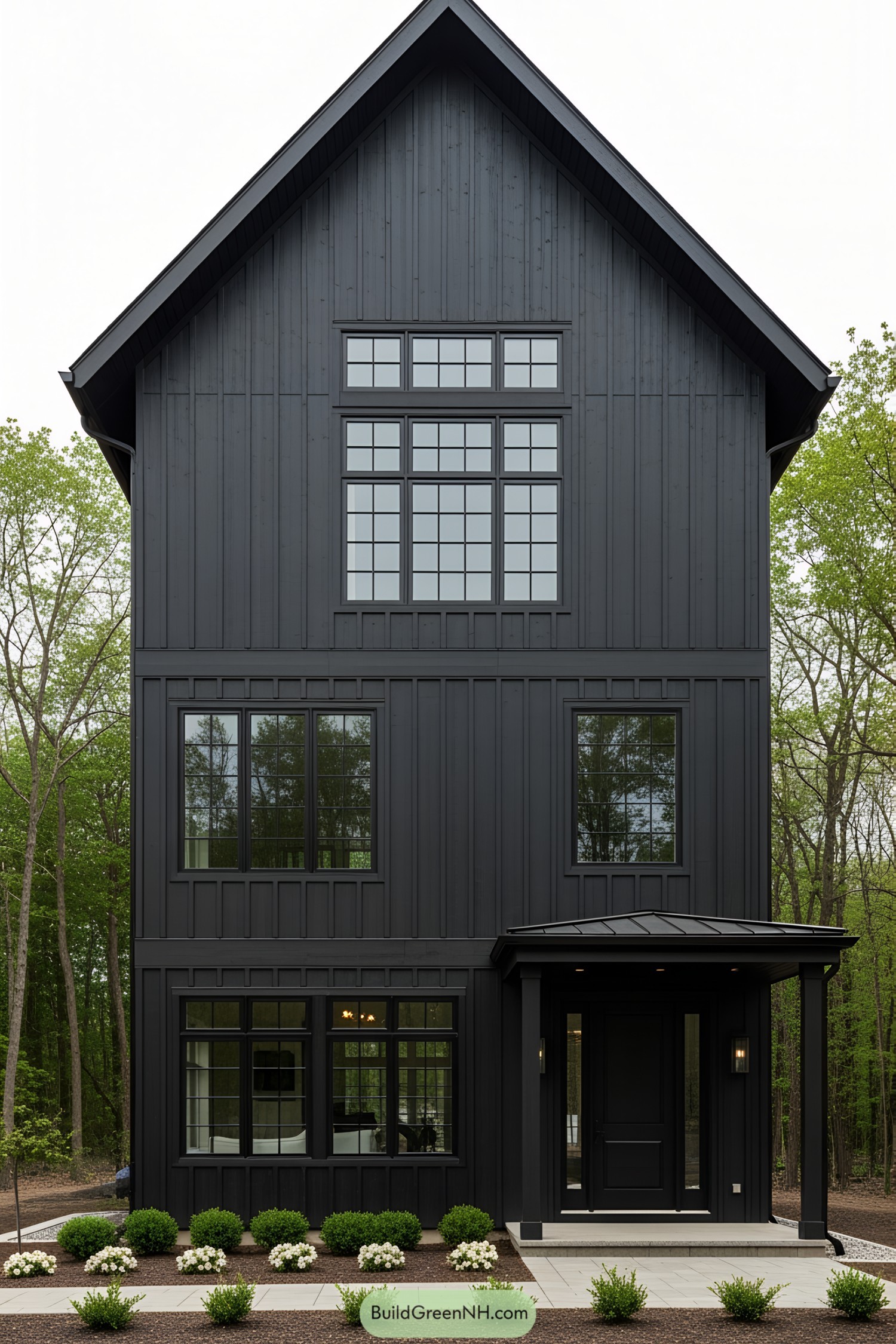 Tall black barn-style house with large windows