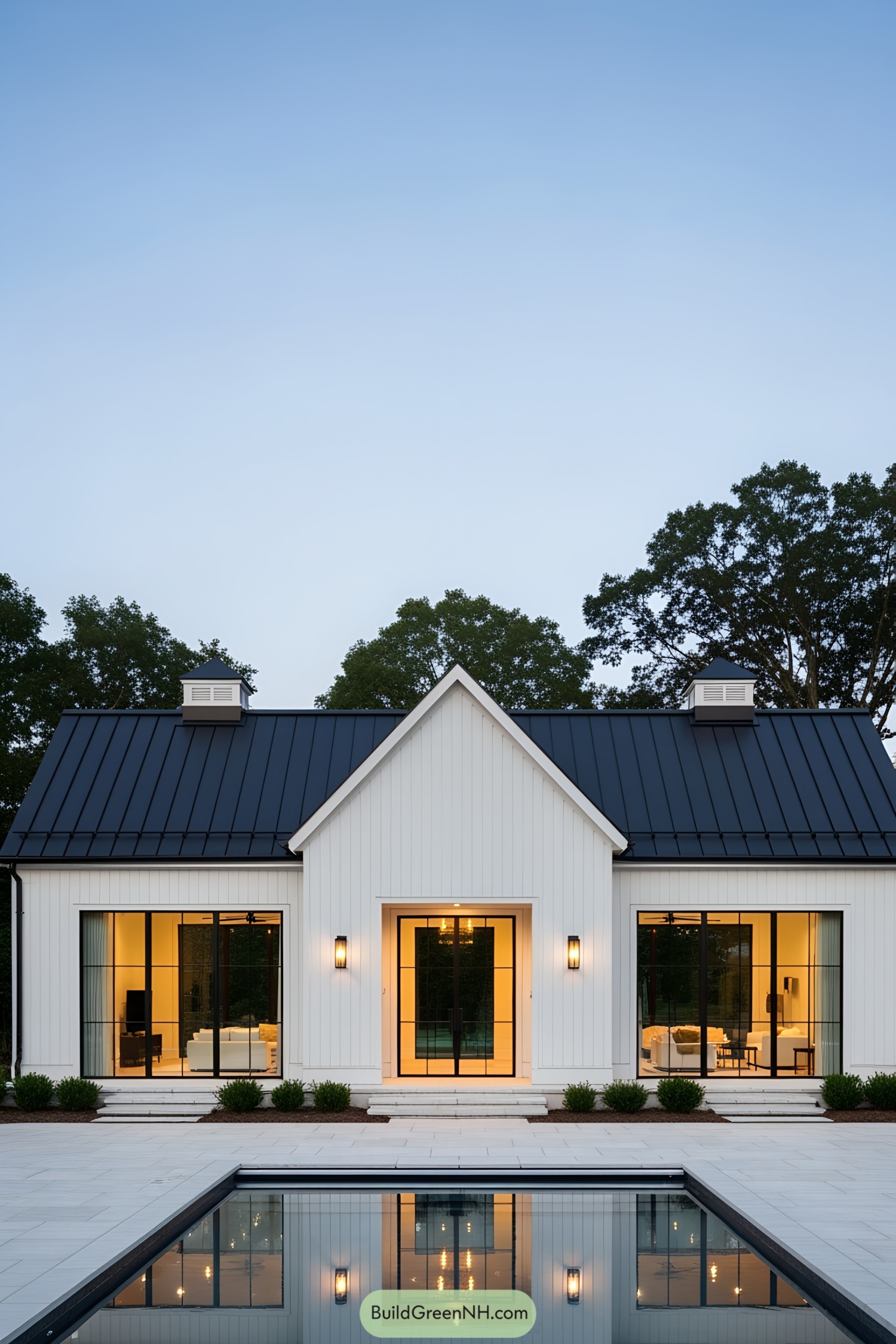 Modern barnhouse with a reflective pool