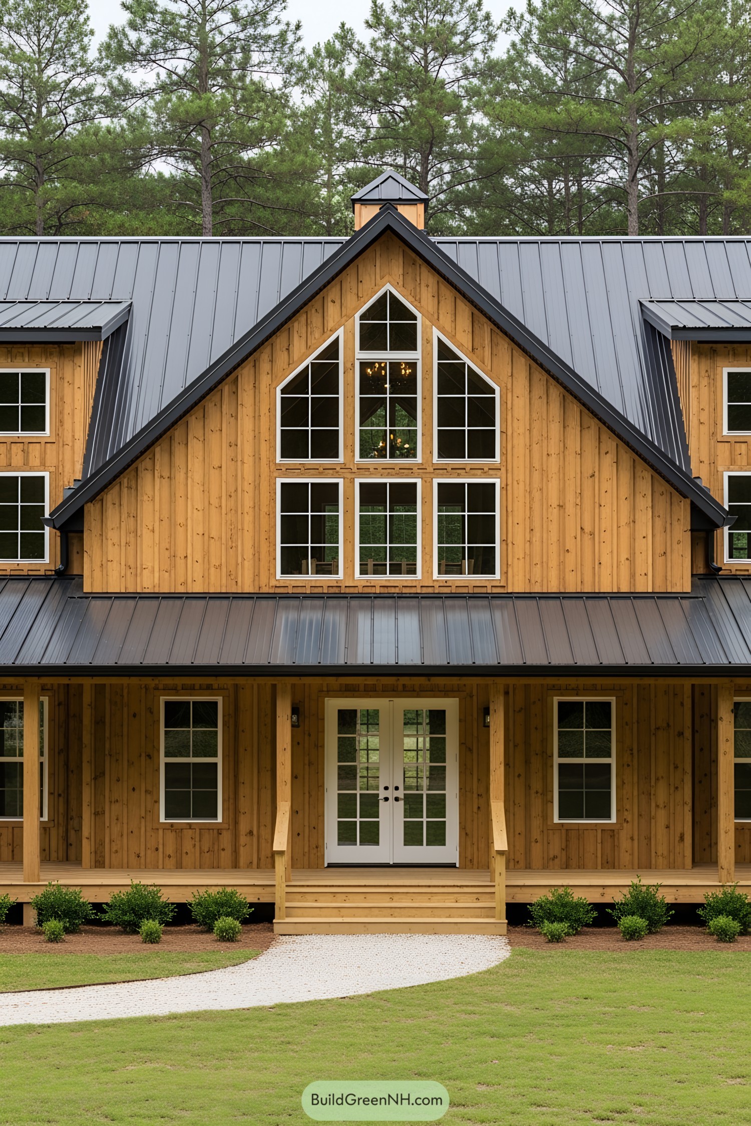 Wooden barnhouse with wraparound porch and metal roof