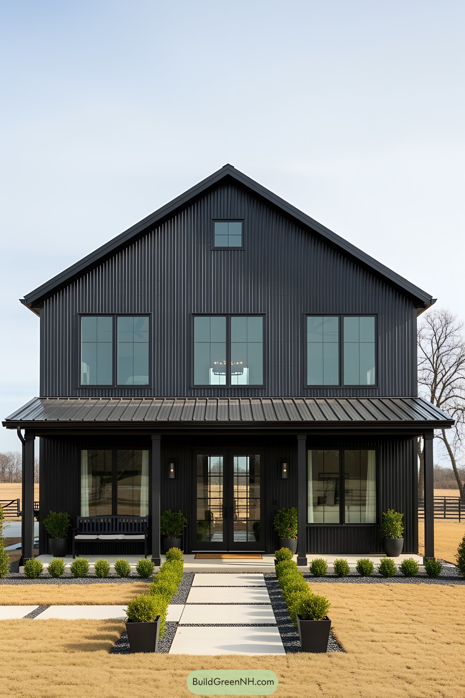 Black barn house with modern design and large windows