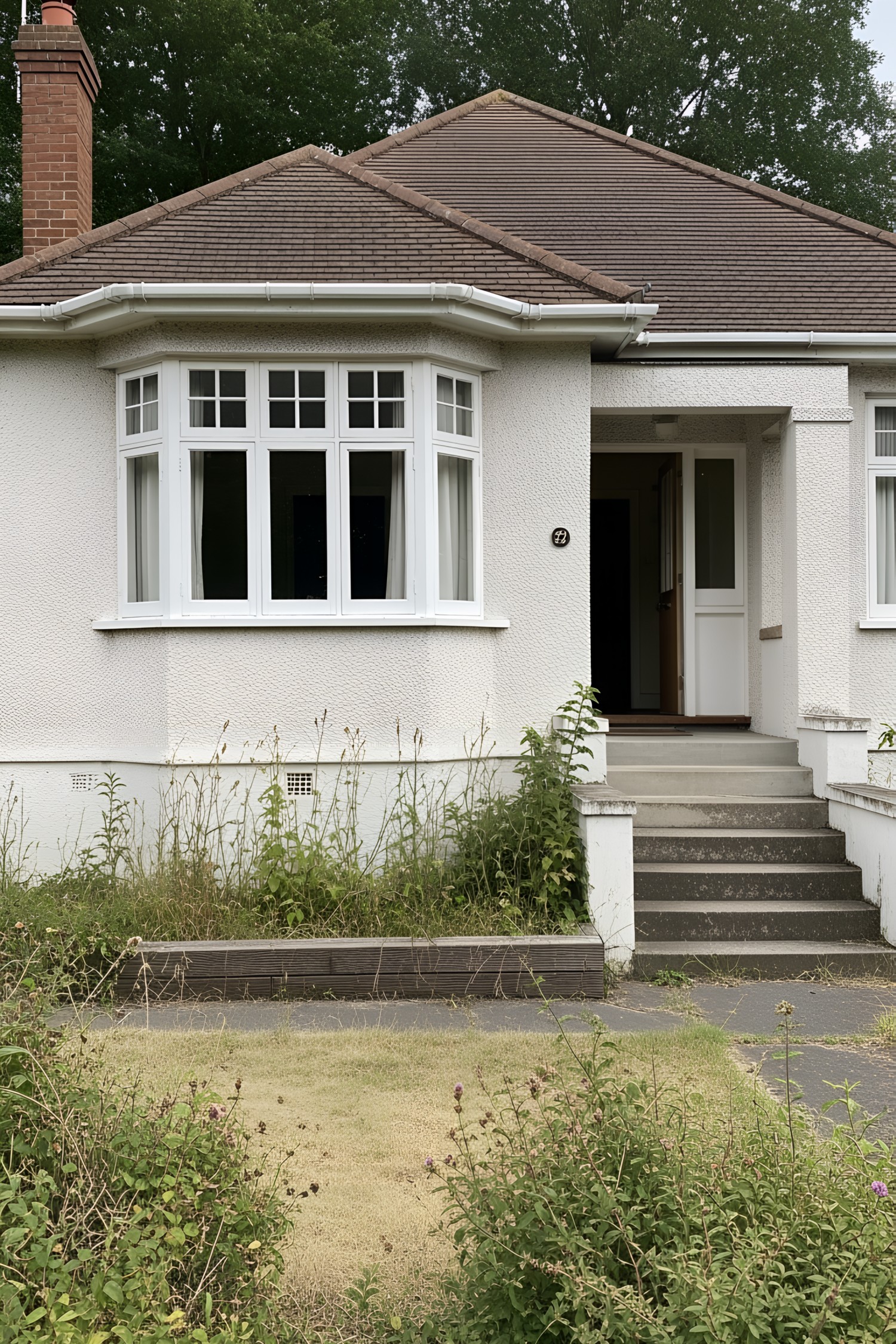 White bungalow with prominent bay window