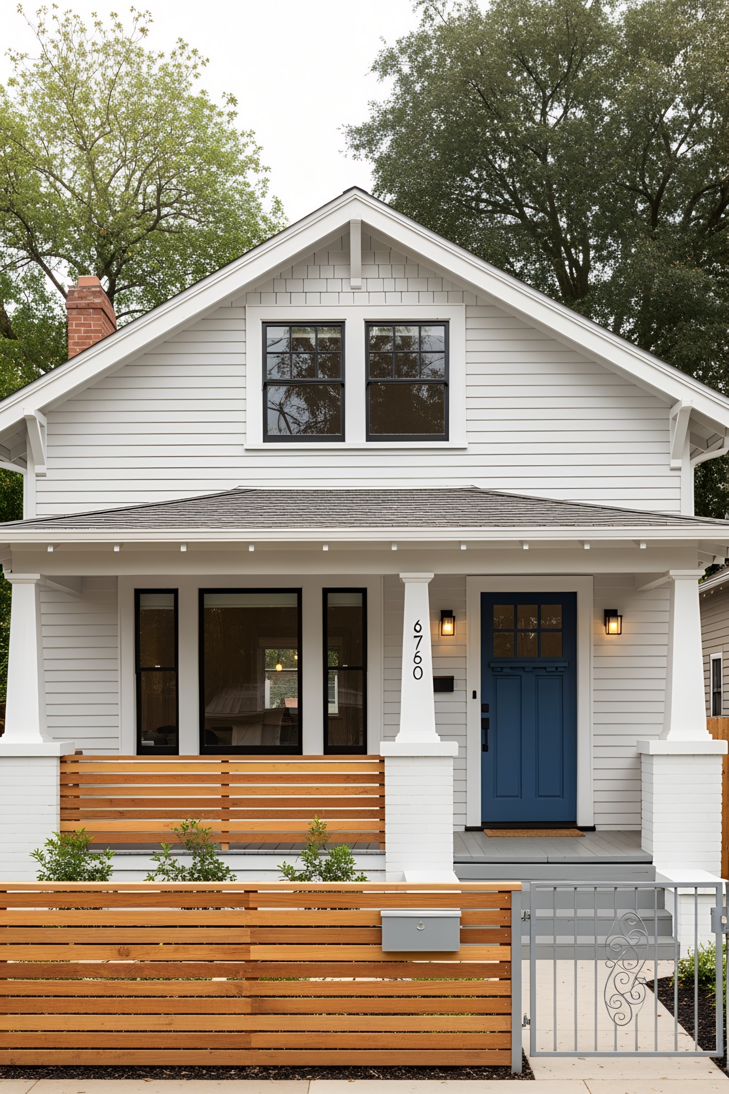 Charming 1930s bungalow with white facade and blue door