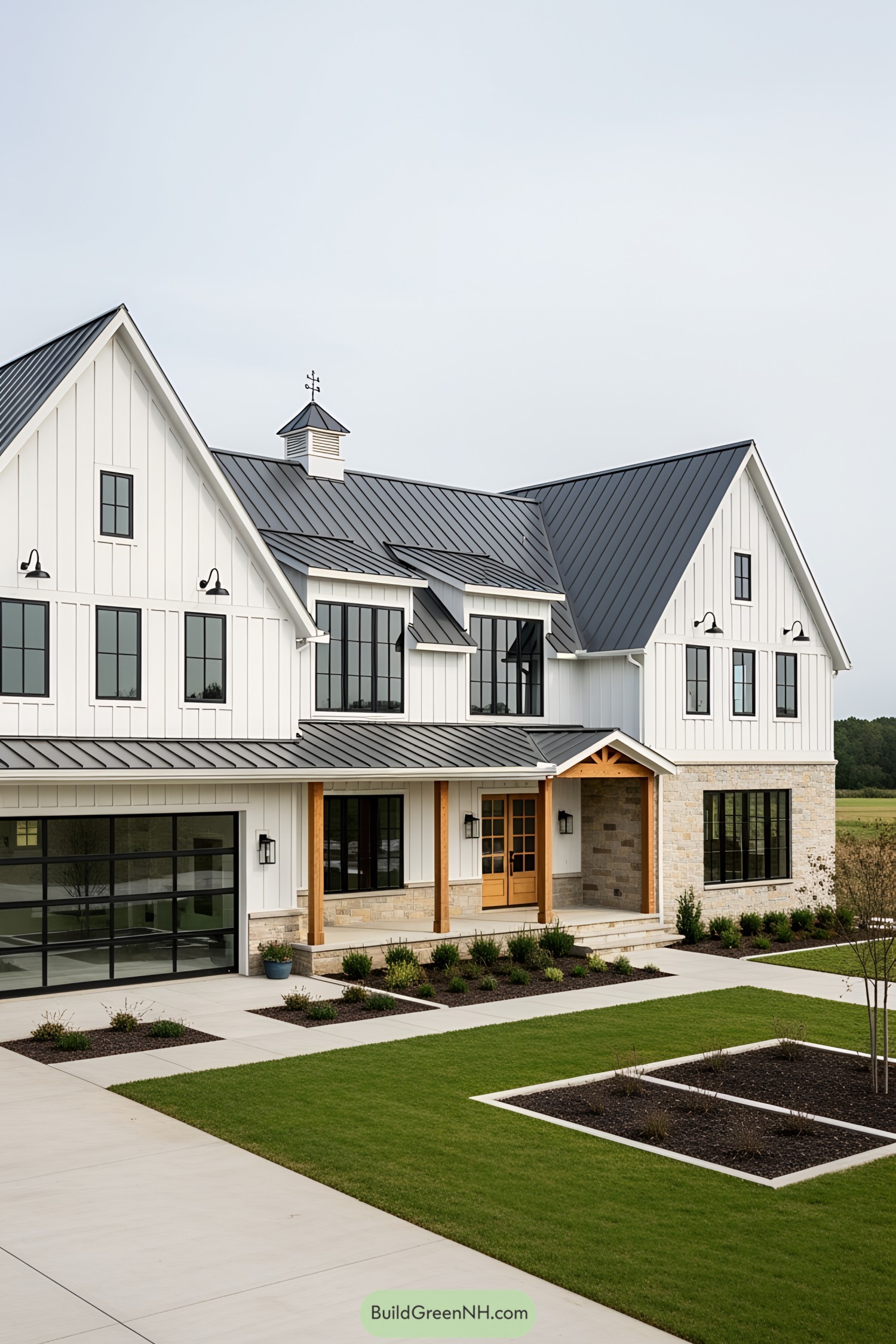 Sleek modern white barn house with manicured lawn