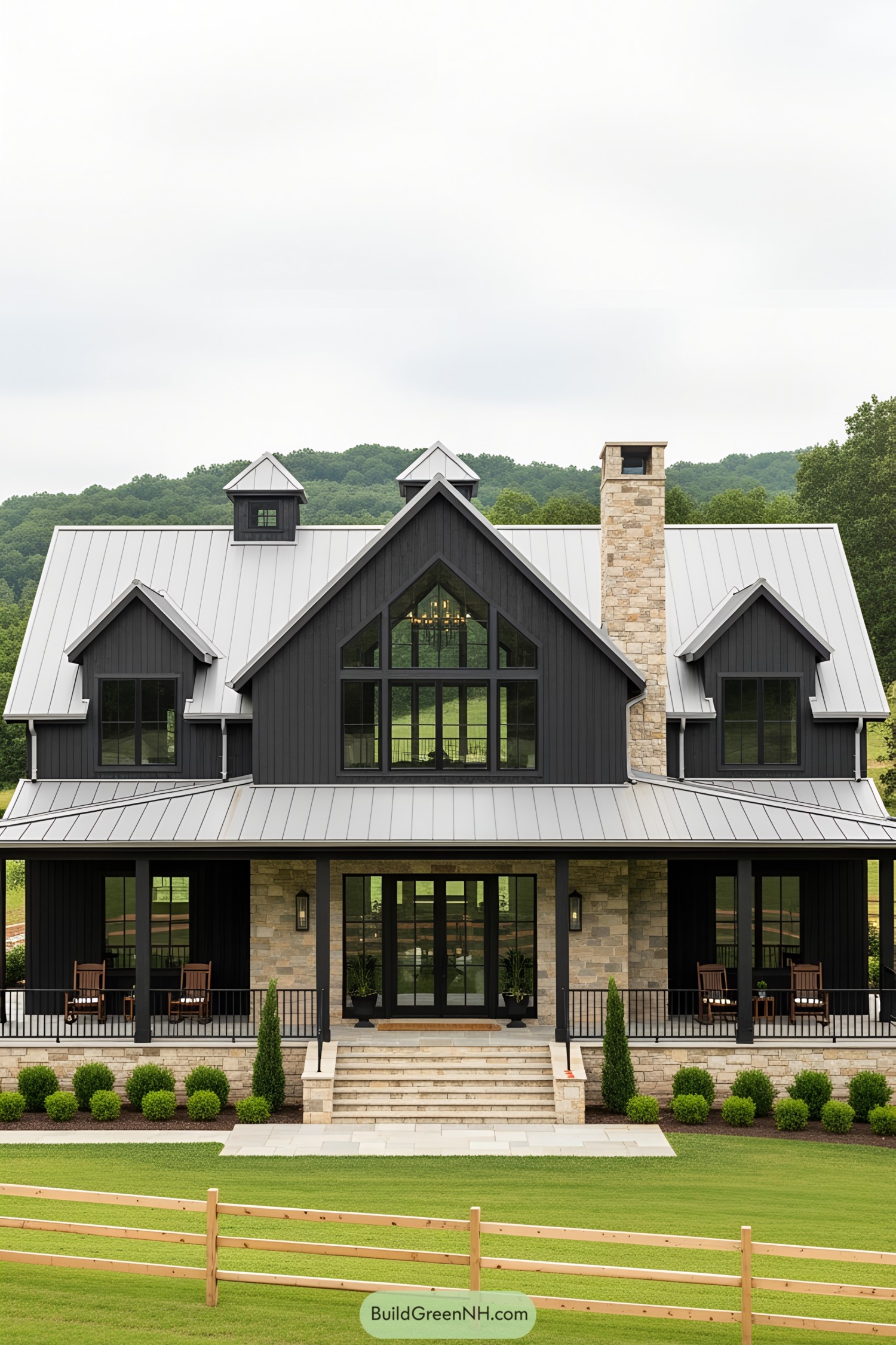 A modern barnhouse with a wraparound porch and lush surroundings