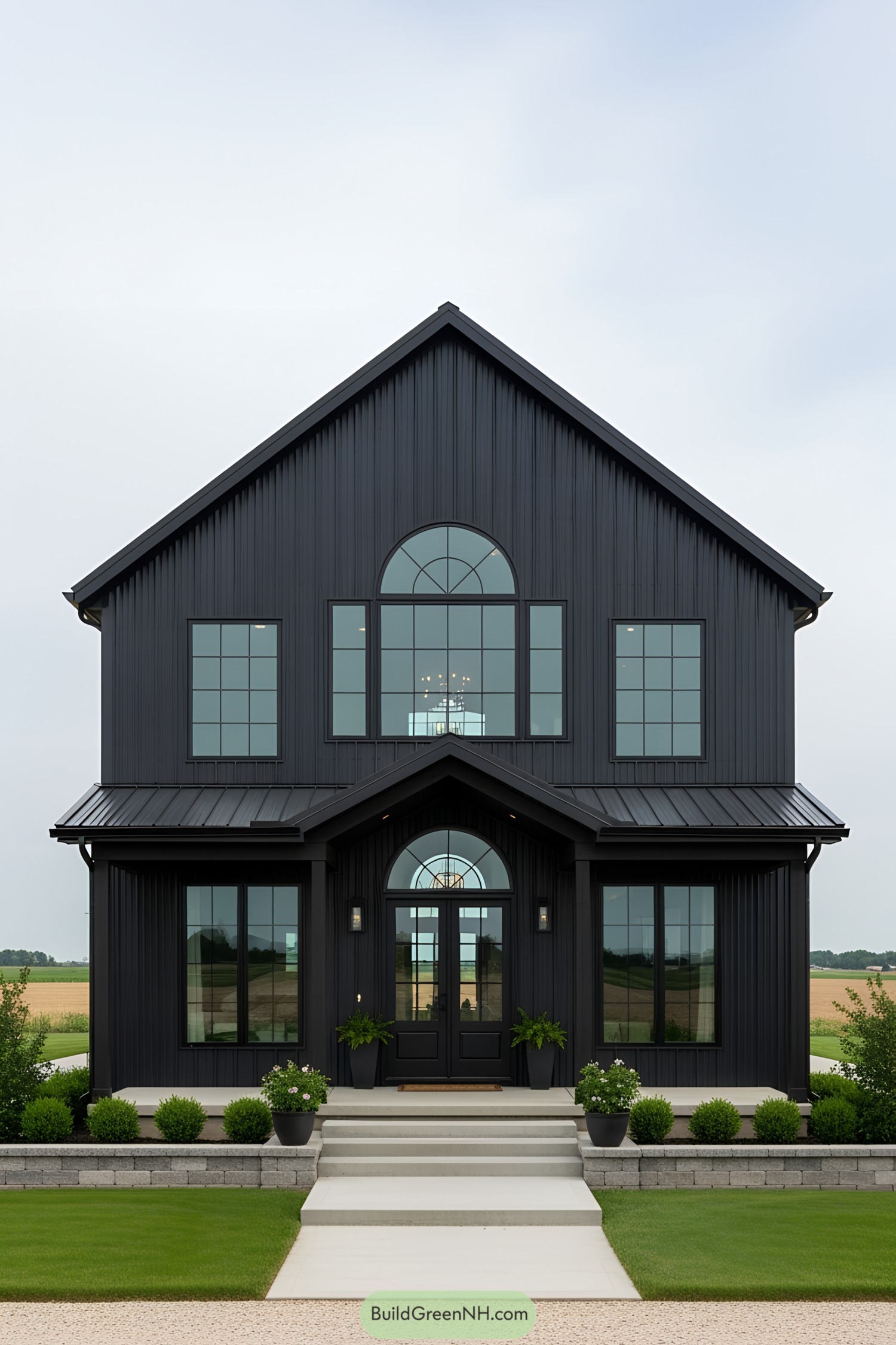 Sleek black barn-style house with large windows