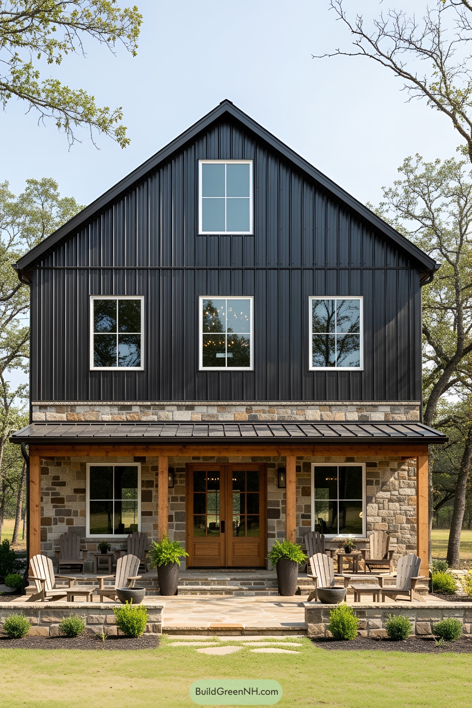 Cozy black pole barn house with rustic charm