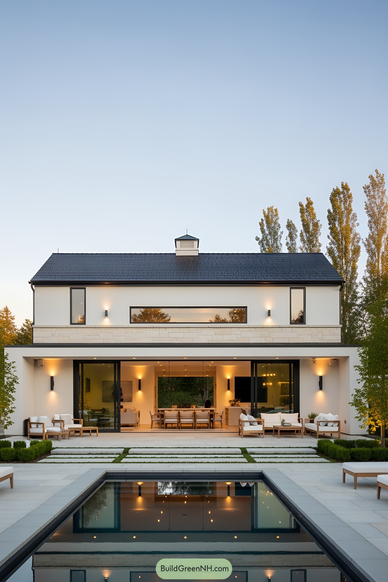 Stylish white barn pool house with modern features and cozy seating