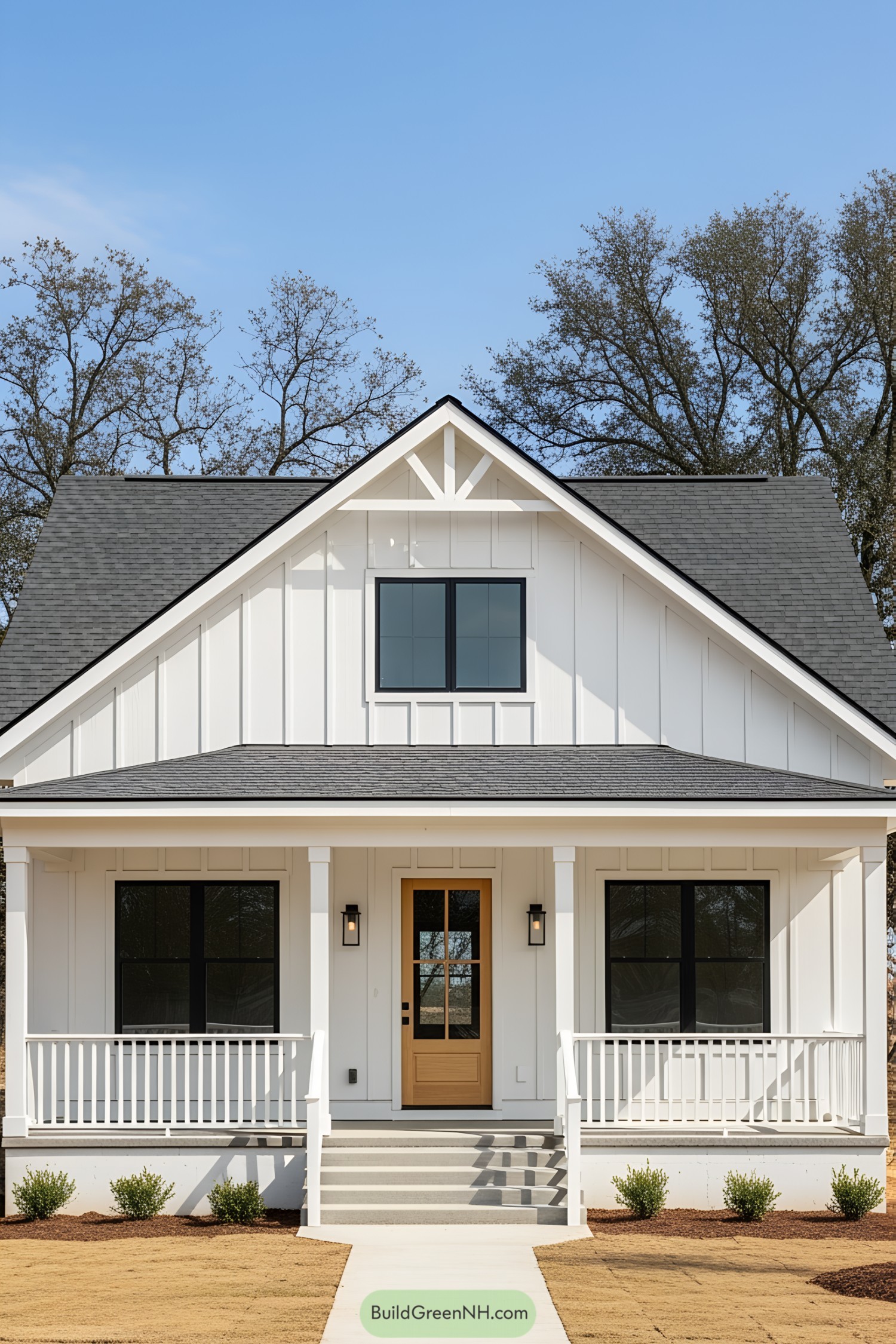 White bungalow with a gabled roof and a welcoming porch
