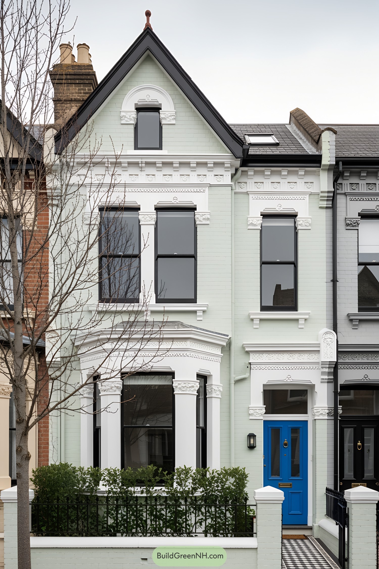 Victorian terrace with a bright blue door and ornate details
