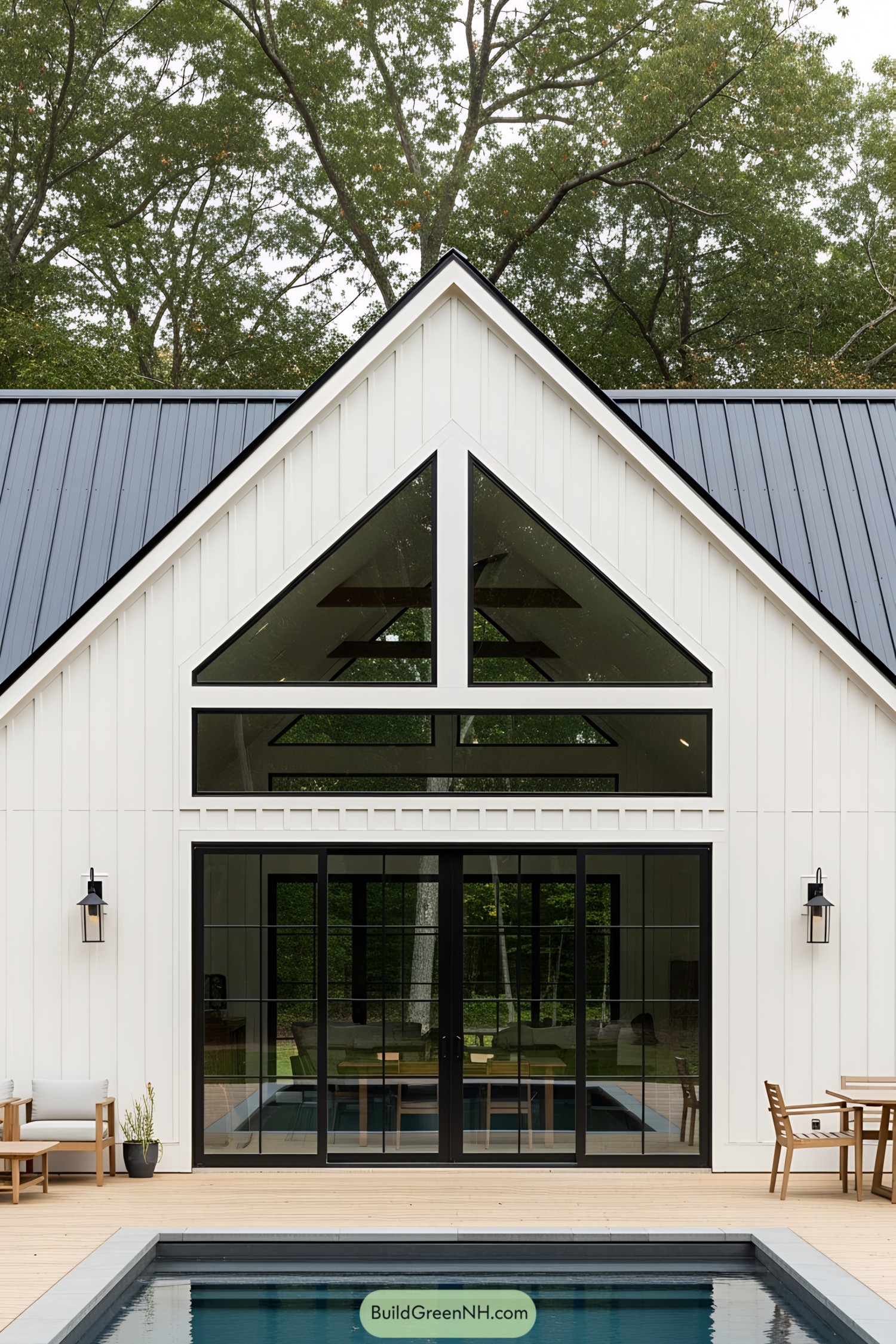 Modern barn house with glass and poolside seating