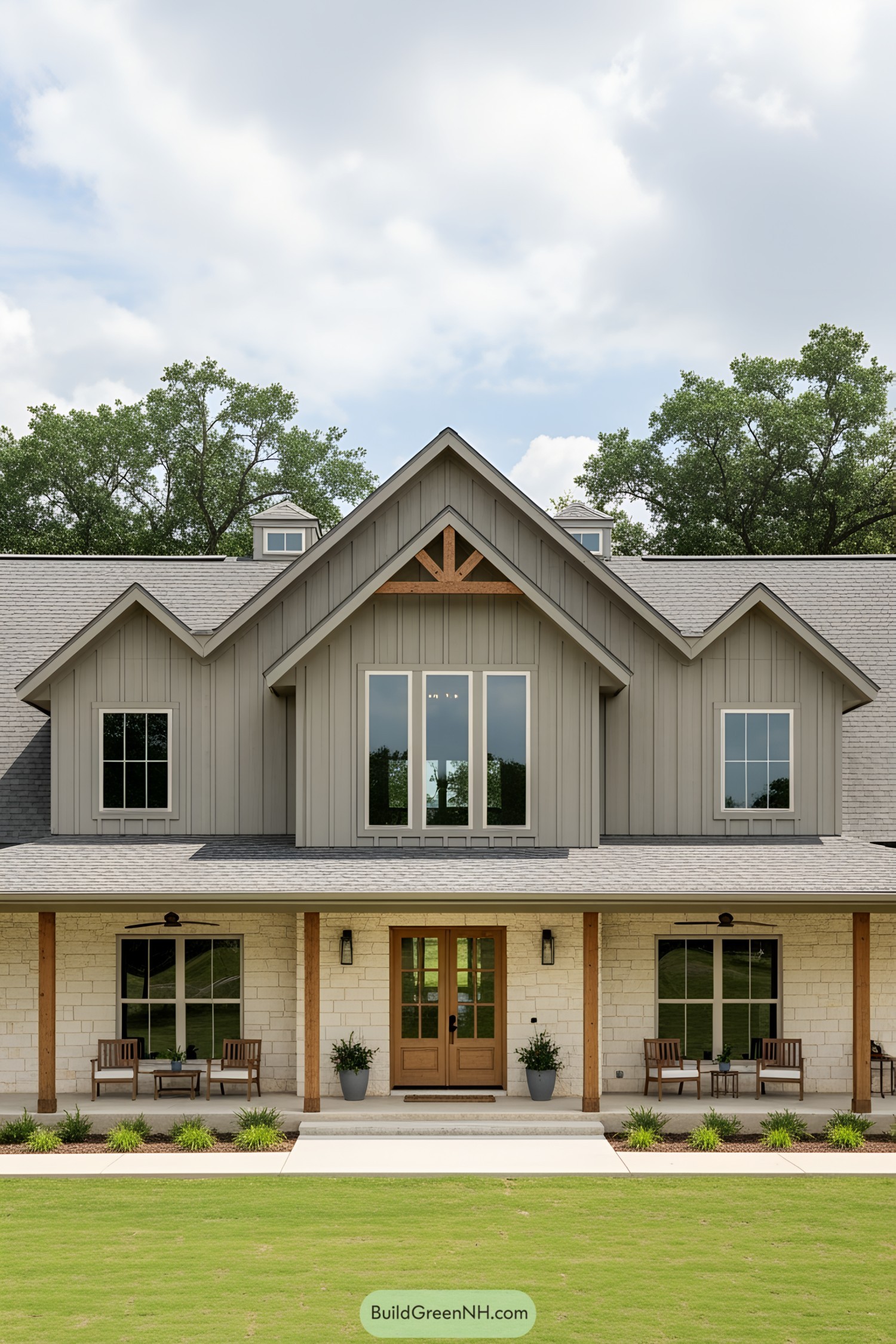 A beautifully inviting barn-style home with a spacious wraparound porch