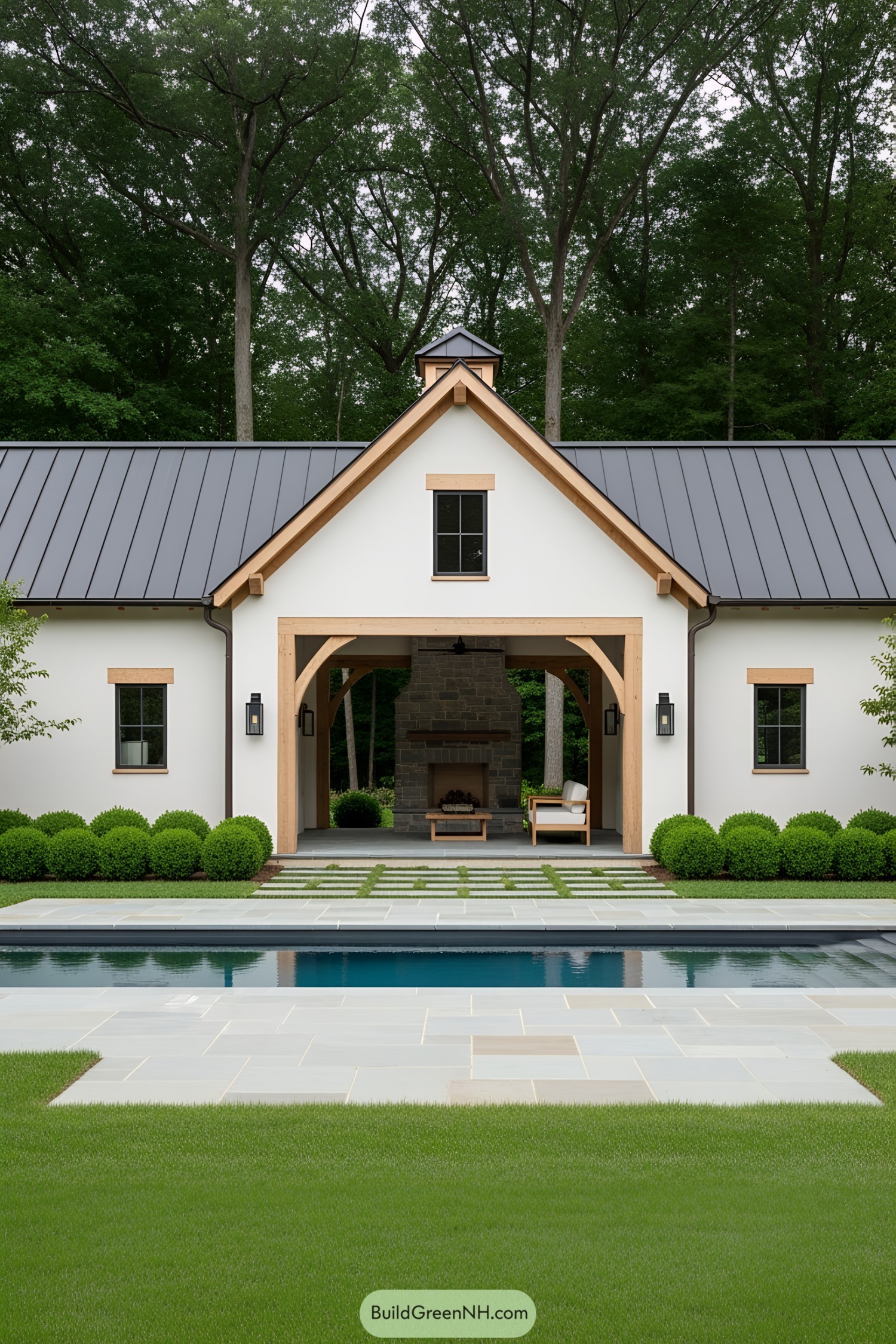 Rustic barn pool house with modern flair and inviting fireplace