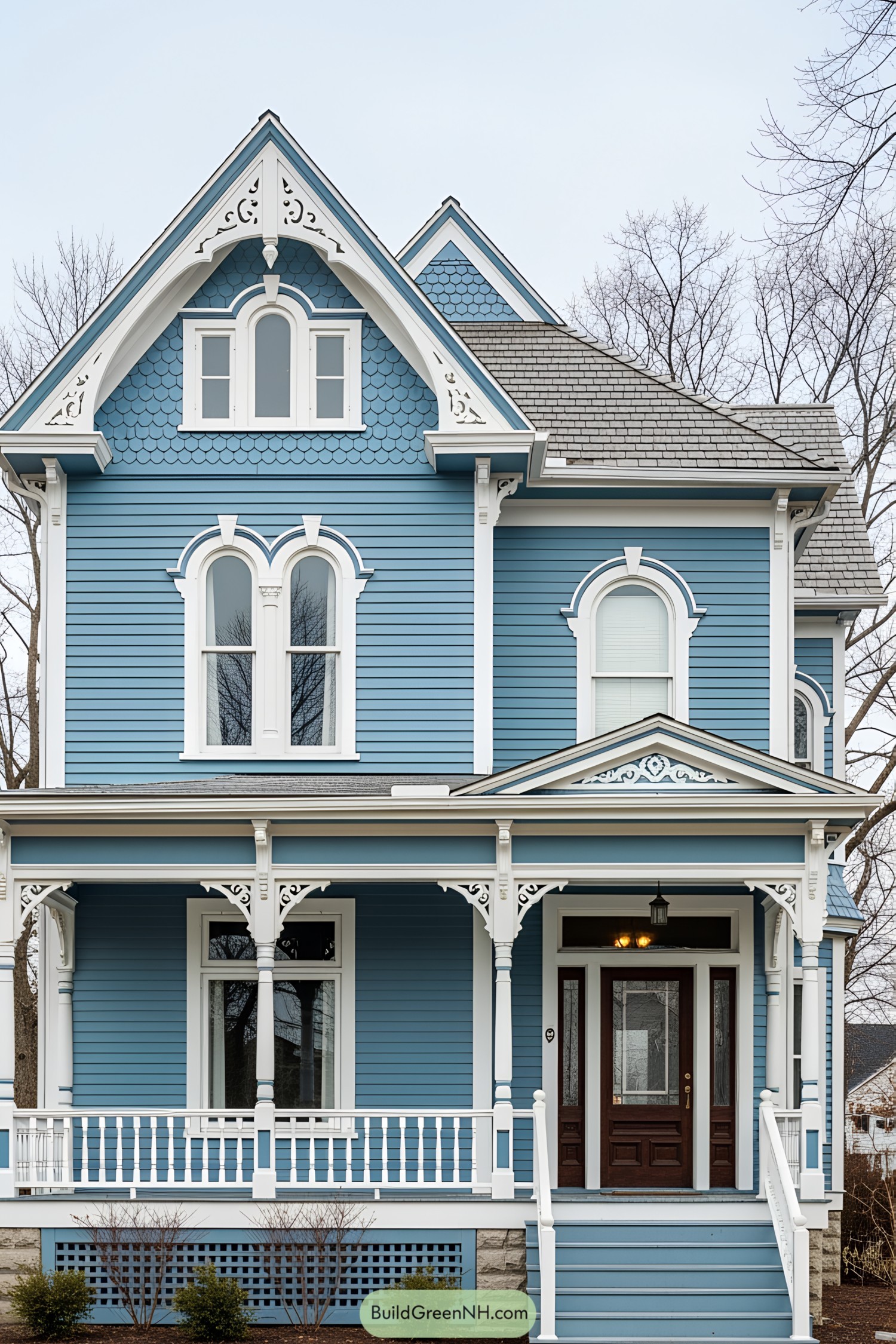 Blue Victorian house with intricate white trim