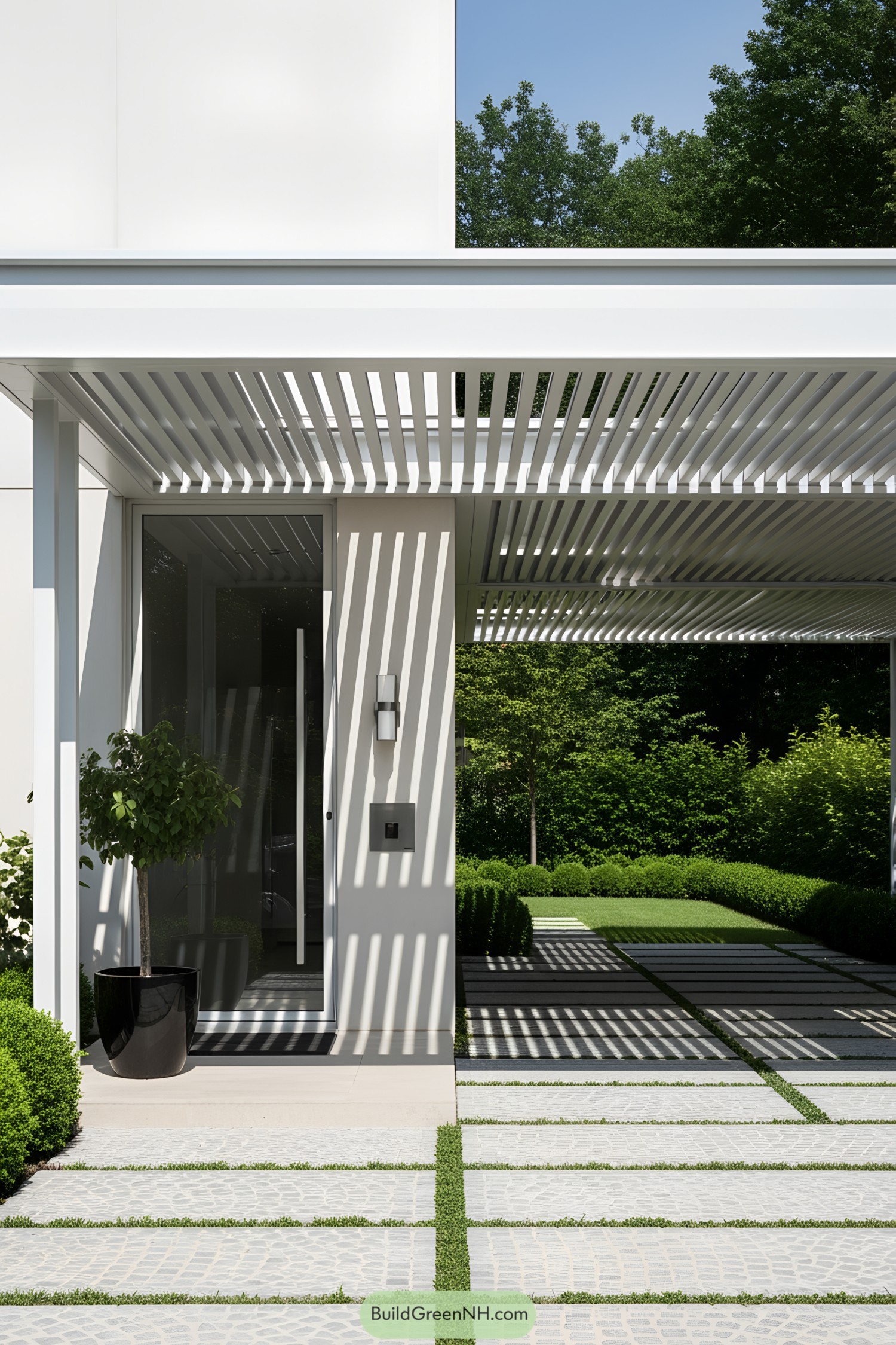 Carport with slotted roof casting shadows on a modern house