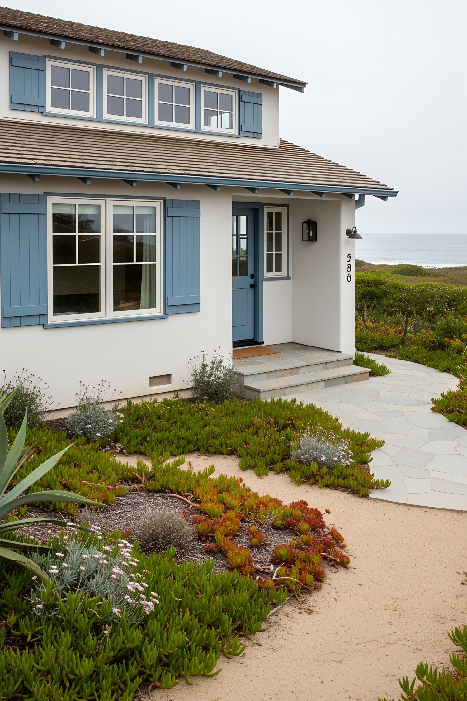 Coastal house with blue accents and ocean view