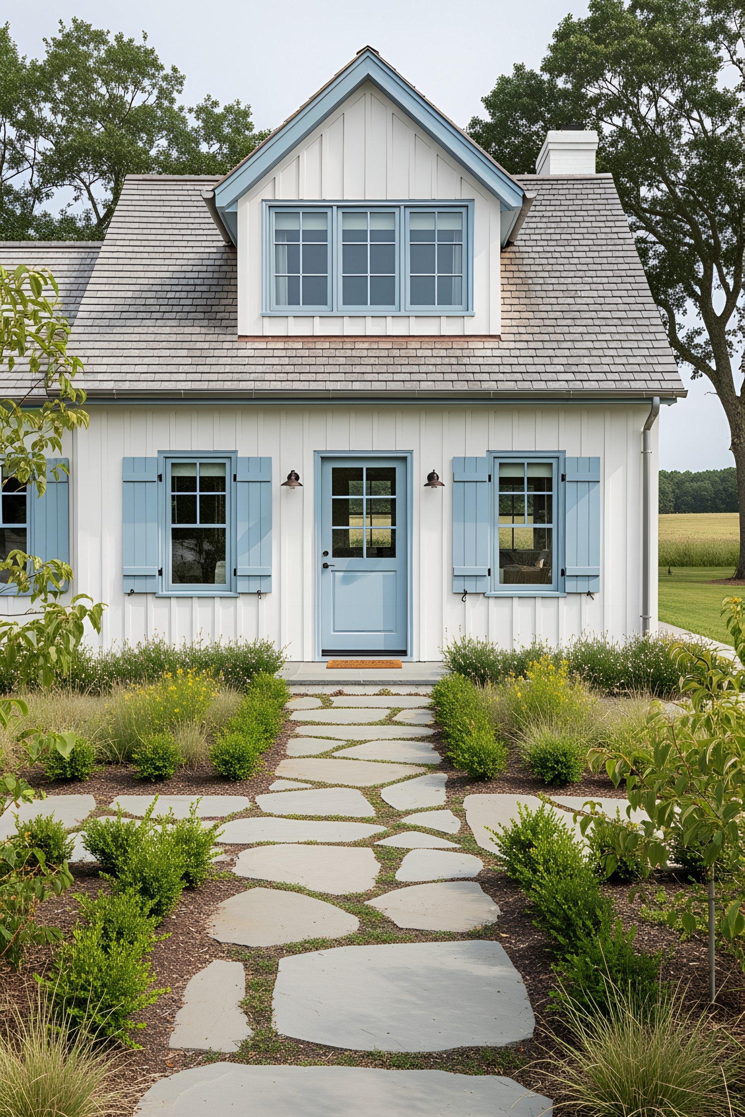 Coastal house with blue shutters and stone pathway