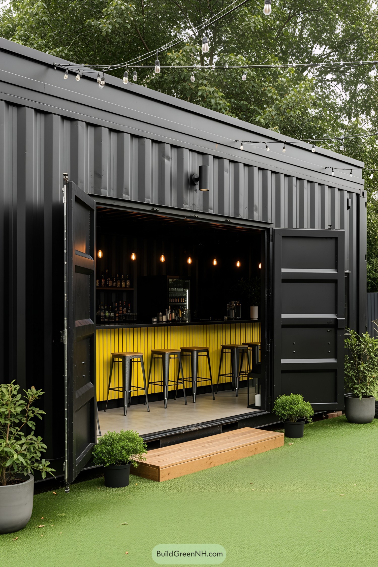 Shipping container bar with stools and hanging lights