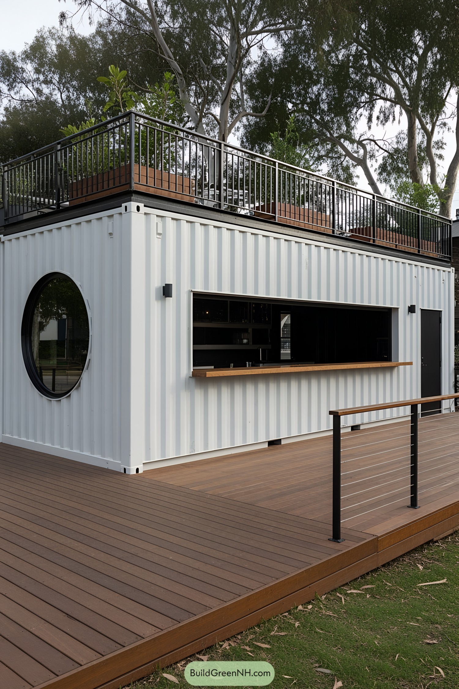 Modern container bar with circular window and wooden deck