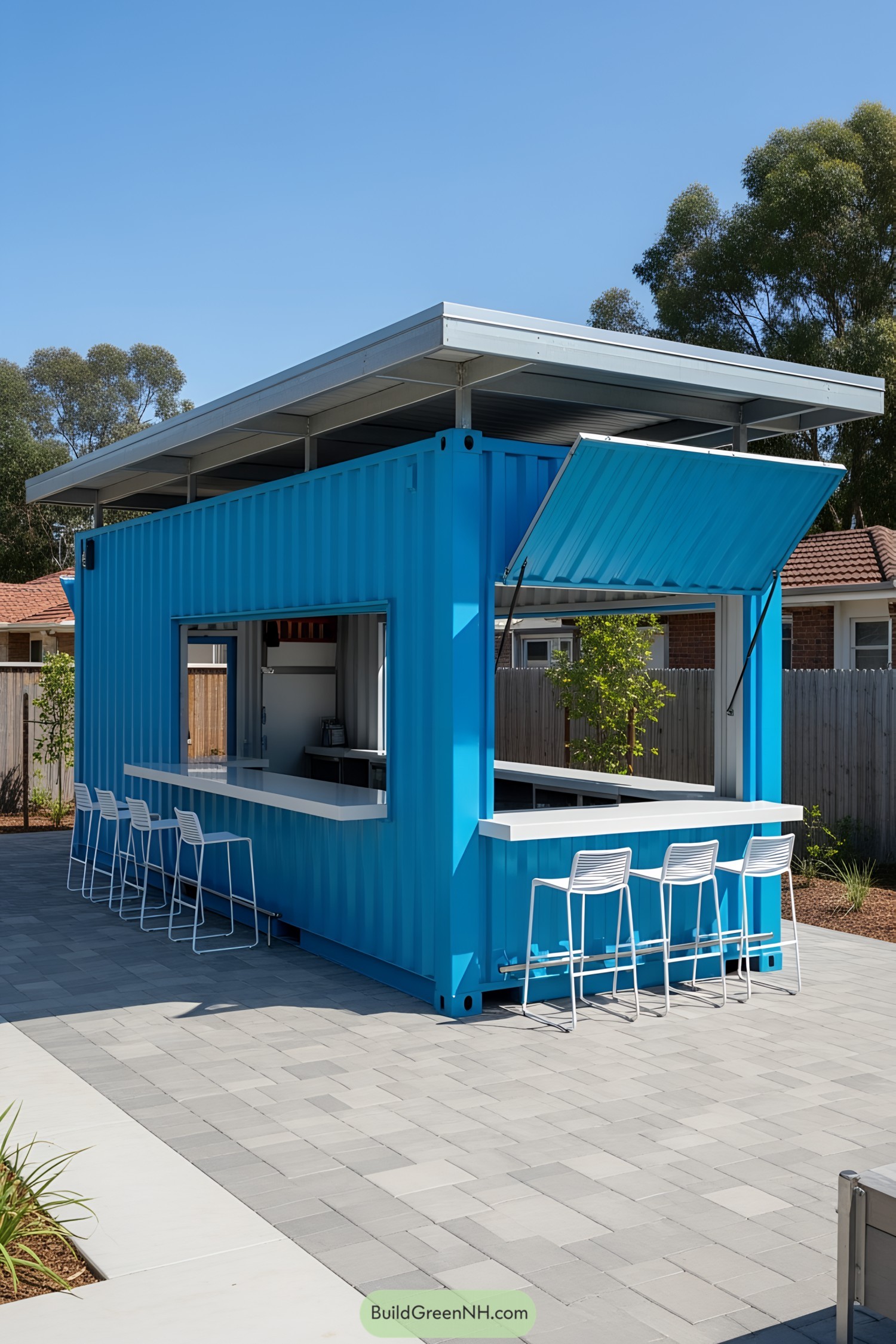 Bright blue container bar with white stools and a modern roof
