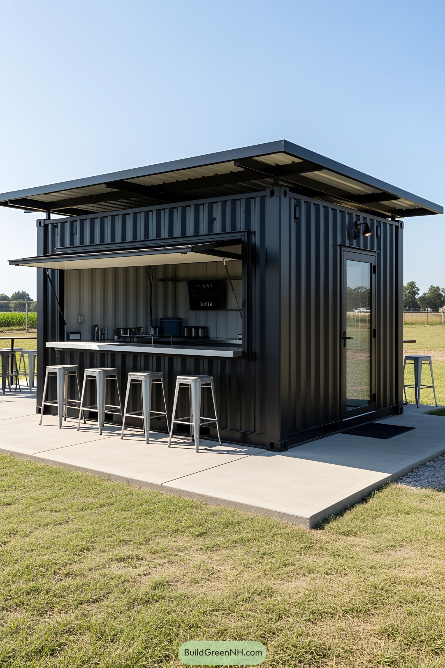 Small container bar with metal stools and open serving window