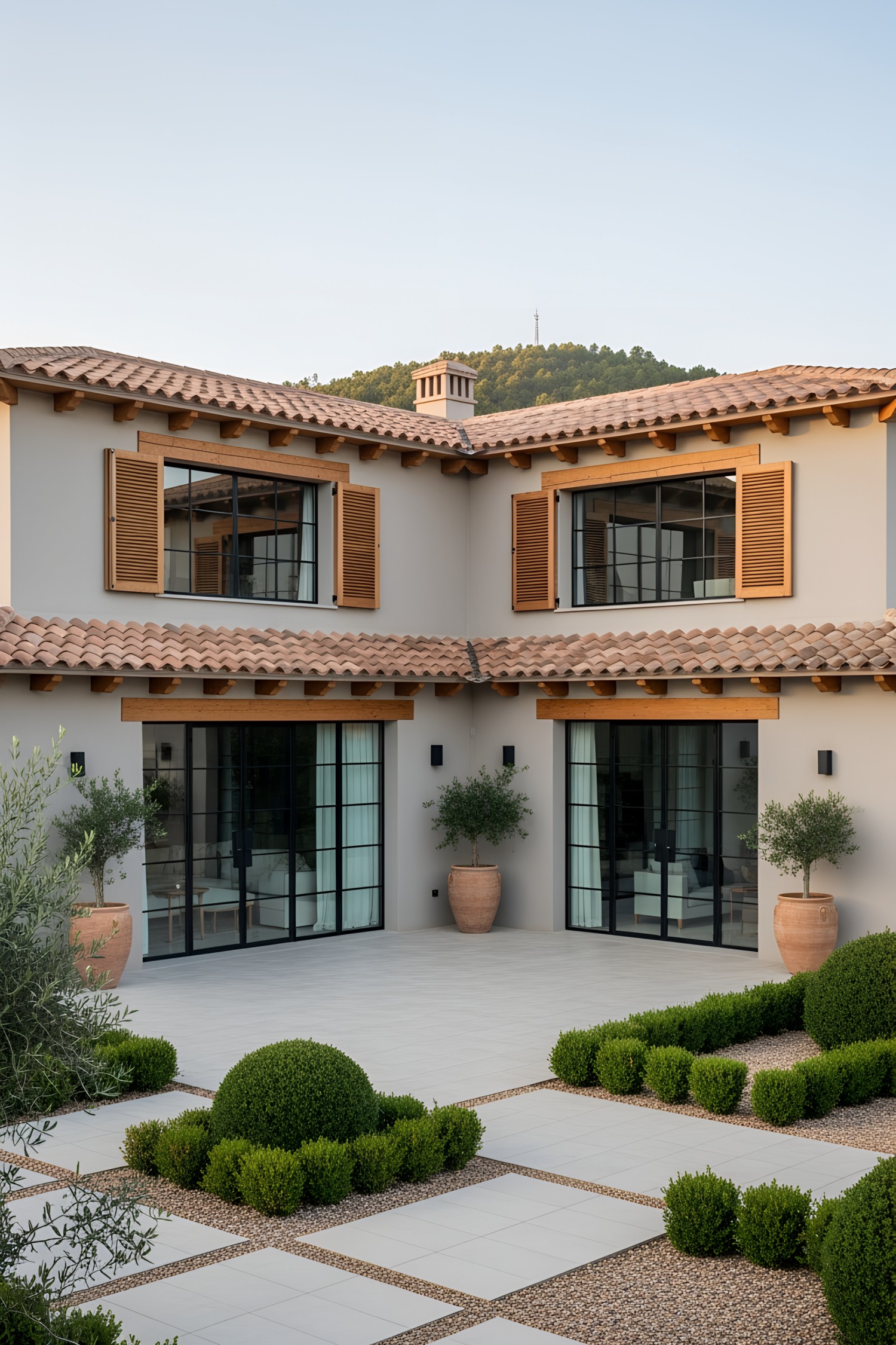 Spanish farmhouse with terracotta roof and lush courtyard